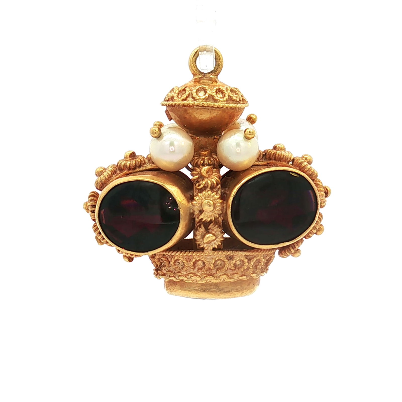Etruscan Style 18K Gold, Garnet, and Pearl Crown Pendant: A crown-shaped pendant crafted in 18K gold, adorned with oval garnet stones and accented by small pearls. The design incorporates circular and rope beaded motifs throughout. Marked 750. Dimensions: 1.