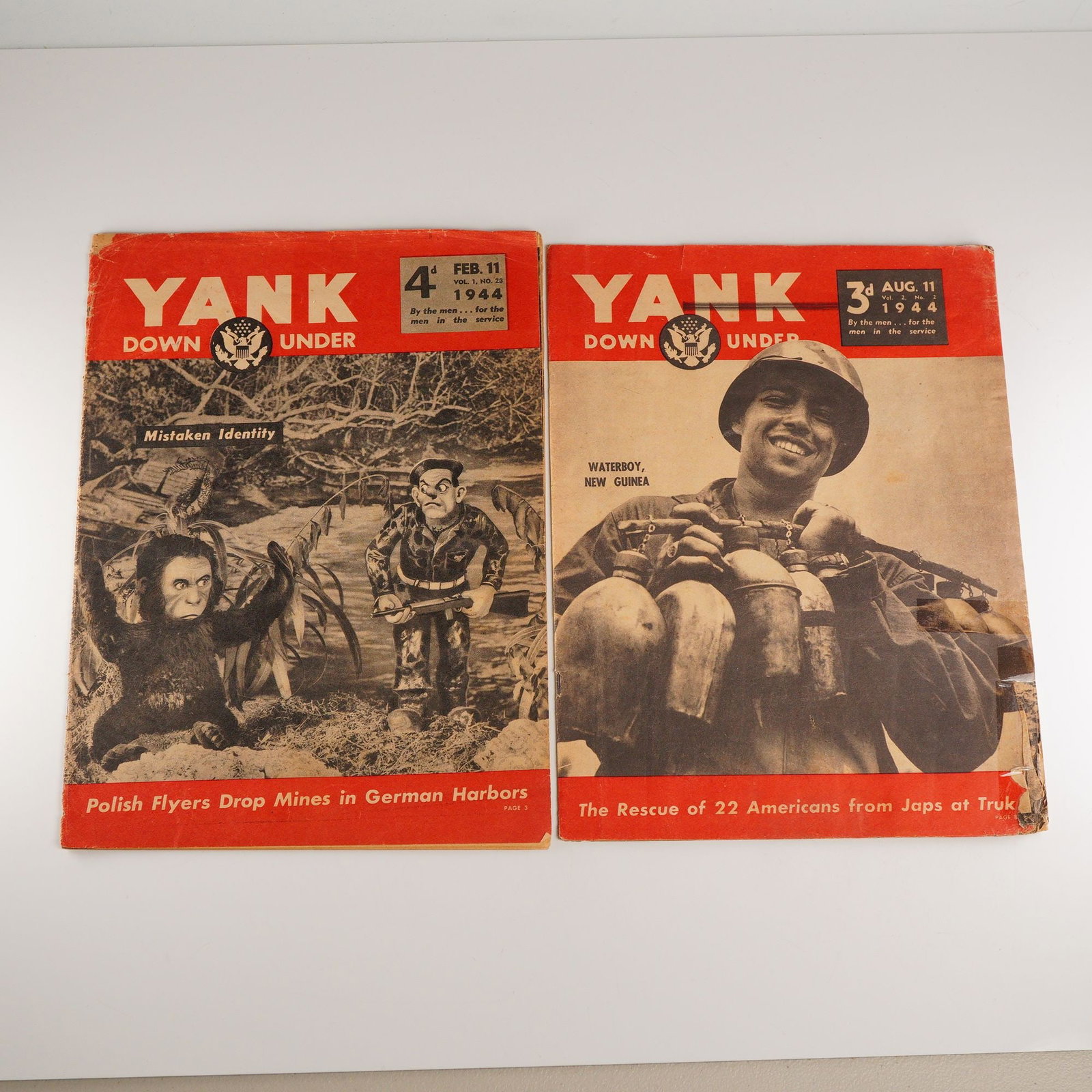 2pc WW2 Era United States Military Yank Down Under Magazines: A pair of original World War II magazines, produced for United States military personnel stationed in the Pacific and Australian theaters. Each issue features news articles, cartoons, pin-up photograp