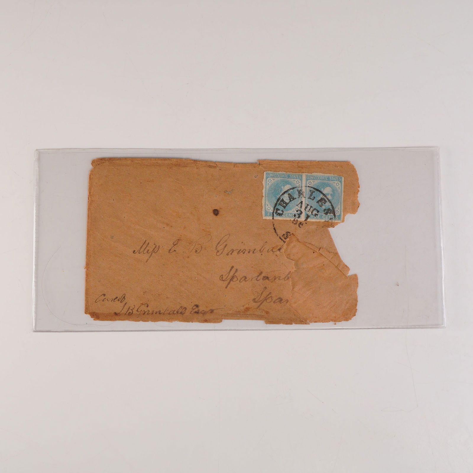 Confederate States Cover with Pair of 5-Cent Blue Stamps: Civil War-era Confederate States envelope bearing a pair of 5-cent blue stamps depicting Jefferson Davis, issued by the Confederate Post Office. The envelope is addressed to Miss E. B. Grimball of Spa