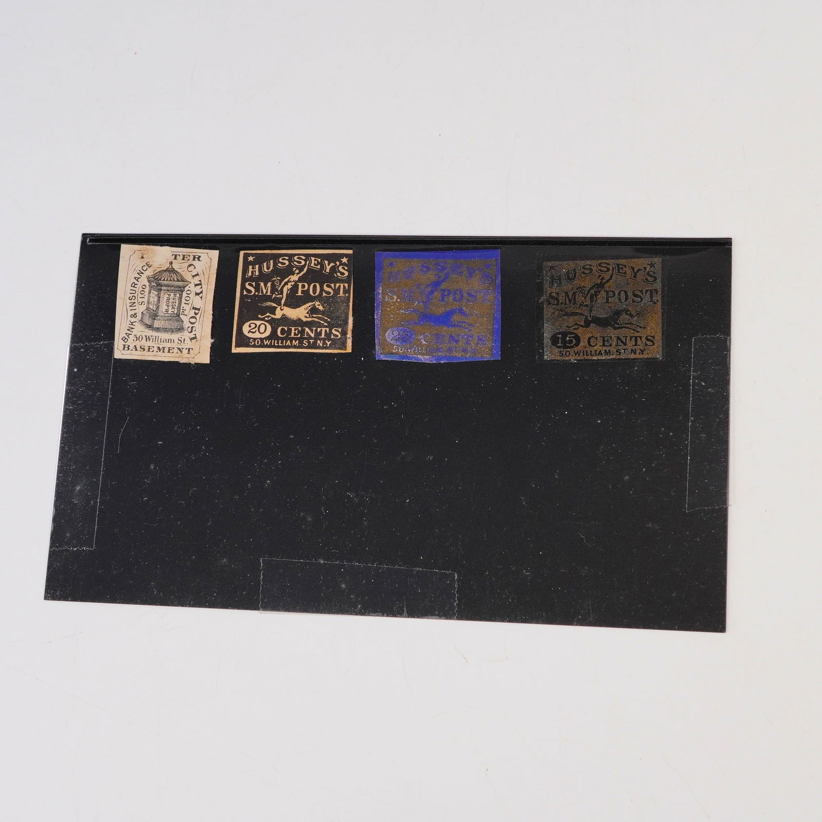 Group of Four Hussey's Local Post Stamps c. 1854: Group of four Hussey's Local Post stamps from New York City, dating to the mid to late 19th century. George Hussey established his private post in 1854 at 50 William Street, offering local mail delive