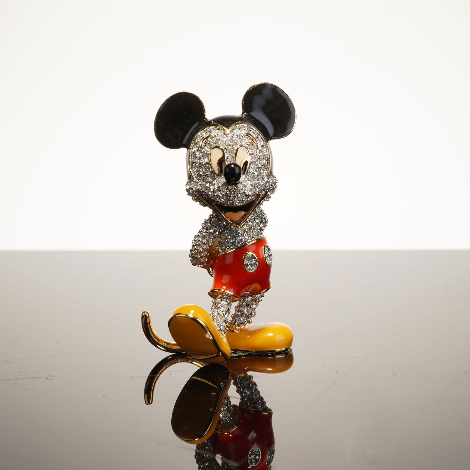 Arribas Brothers Mickey Mouse Jeweled Figurine, 2.5": Arribas Brothers, enameled metal and pave-set Swarovski crystals. The underside of the left shoe features an embossed (c) Disney mark. This Arribas Collection figurine depicts Mickey Mouse in a classi