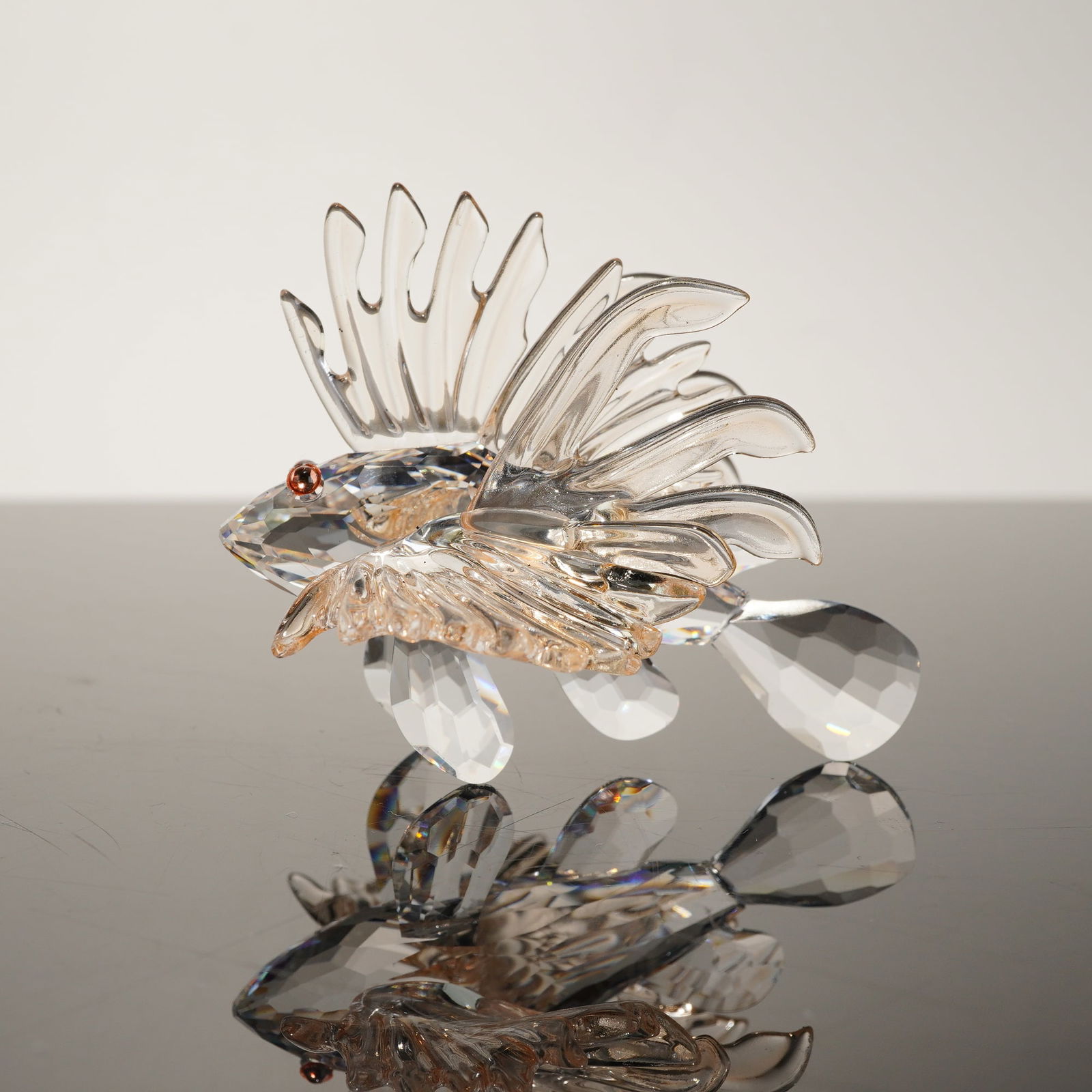 Swarovski Crystal Lionfish Figurine, South Sea Collection: This professional Swarovski crystal figurine depicts a Lionfish from the "South Sea" collection. Designed by Heinz Tabertshofer and introduced in 2003, the piece (Model 604011 / 622551) is meticulousl