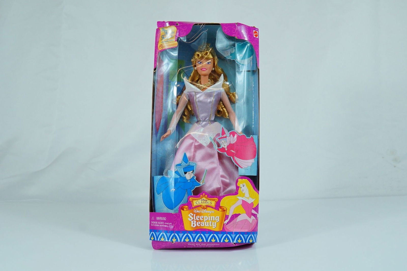 Mattel Disney's Sleeping Beauty My Favorite Fairytale Collection Doll, 11.5-inch: Produced by Mattel in 1999 as part of the My Favorite Fairytale Collection, this vinyl fashion doll depicts Princess Aurora from Walt Disney's Sleeping Beauty. The doll features rooted blonde hair sty