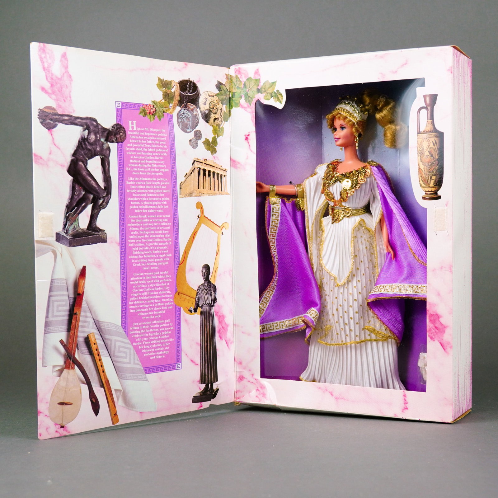 Mattel, Grecian Goddess Barbie Doll, 11.5 Inches: Manufactured by Mattel, Inc., this vinyl collectible doll is Volume Seven of The Great Eras Collection, released circa 1995. The doll features rooted blonde hair styled in a high ponytail with