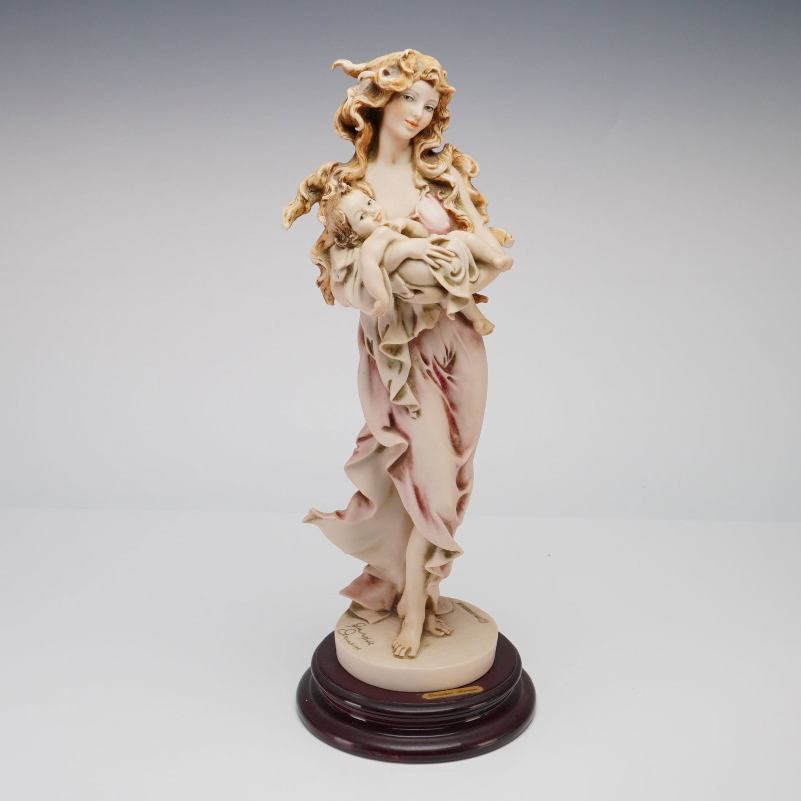 Florence Giuseppe Armani Figurine, Loving Arms: A Florence Sculture d'Arte cold-cast porcelain figurine titled Loving Arms (model 880E), designed by artist Giuseppe Armani. This elegant Art Nouveau-inspired piece depicts a slender woman with long,