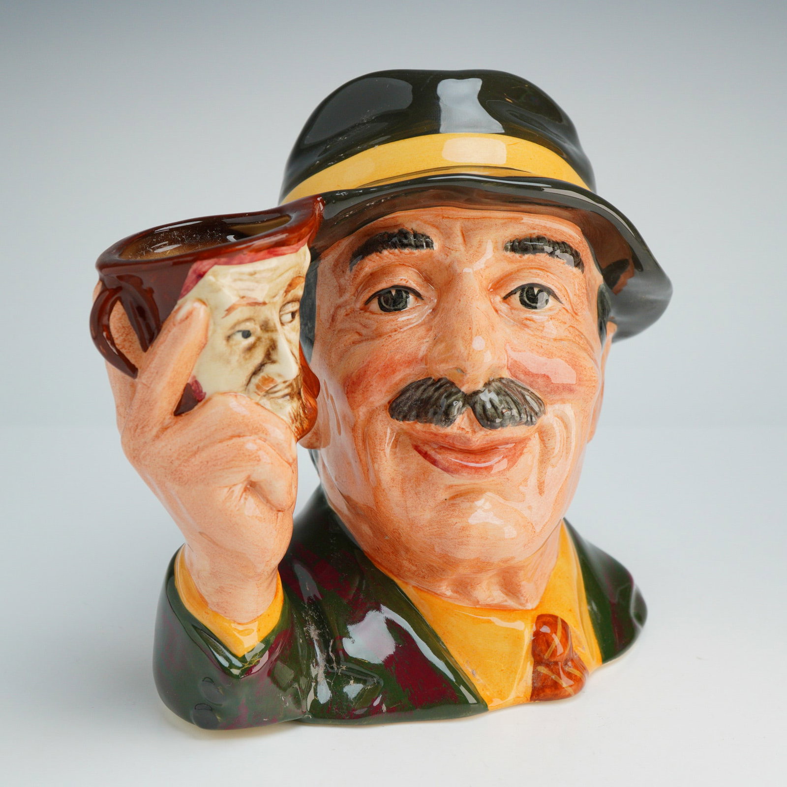 Royal Doulton Large Character Jug, Collector D6796: This piece is part of The Collecting World series and was produced in 1987 as a special edition of 5,000 for Kevin Francis Ceramics. The jug was modeled by Stanley James Taylor based on an original co