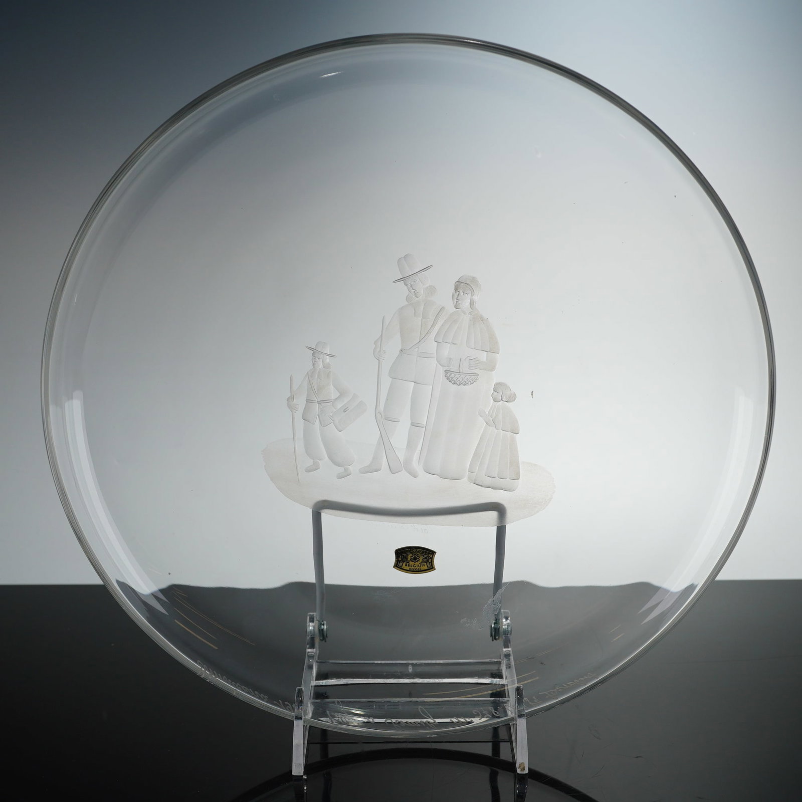 Val Saint Lambert Americana Collection Crystal Cabinet Plate, Pilgrim Family: This is a fine lead crystal collectors charger from the renowned Belgian glassworks, Val Saint Lambert. Part of the Americana Collection issued in 1969, the center of the plate features a finely