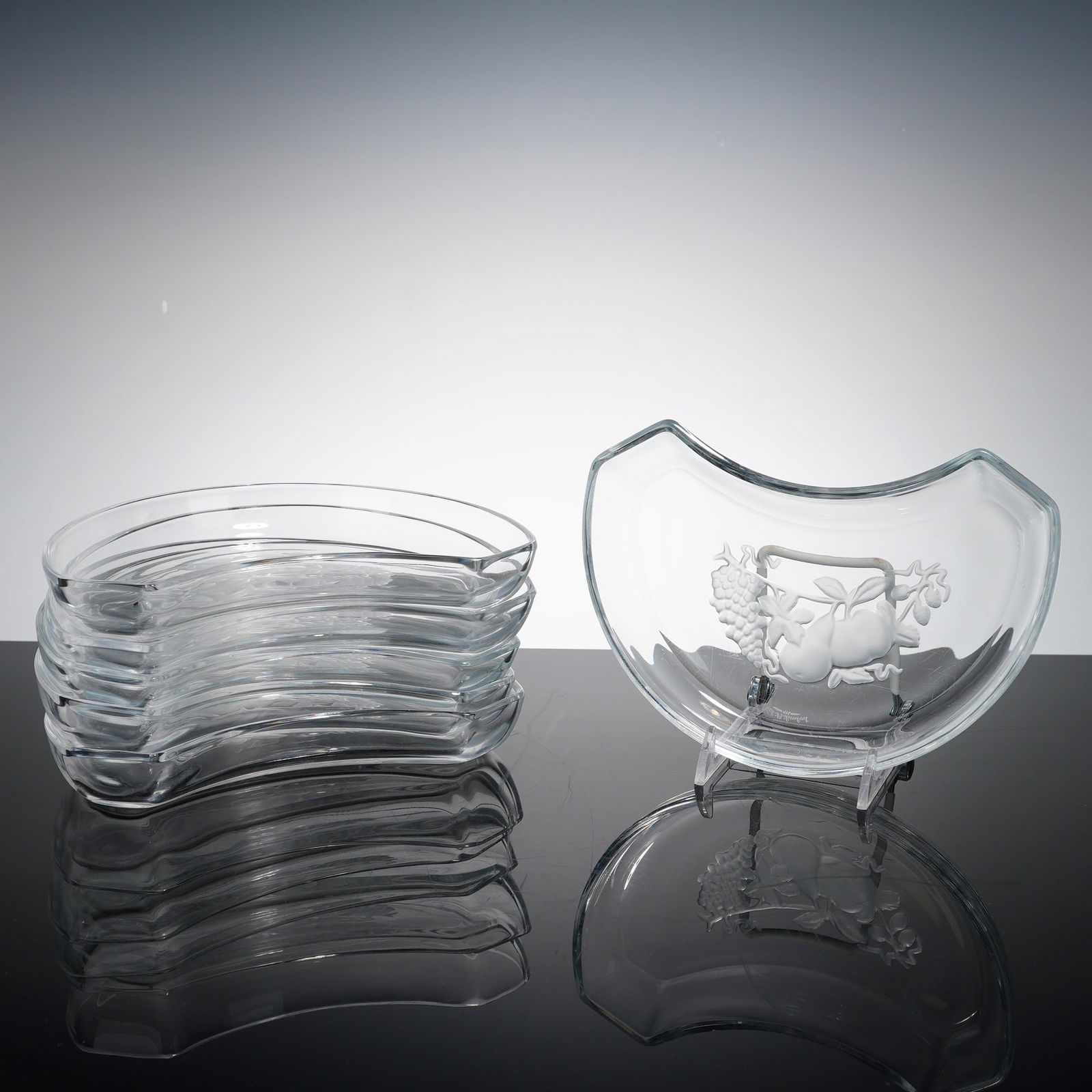 6pc Val Saint Lambert Brussels Pattern Crystal Crescent Salad Plates: A set of six Val Saint Lambert crystal crescent salad plates with etched fruit motif. These elegant side dishes, also known as bone plates, are crafted from high-quality clear lead crystal by the pres