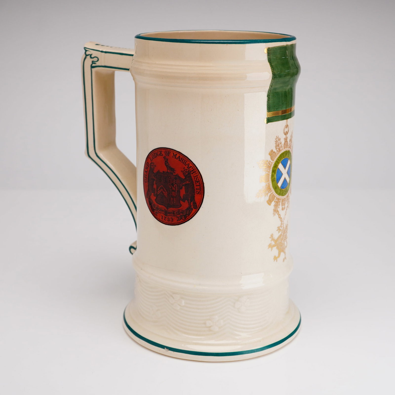 Richard Briggs Ceramic Masonic Tankard Grand Lodge Massachusetts Scotland: This fine cream-colored glazed ceramic tankard was retailed by the prestigious Richard Briggs Company of Boston, a firm known for high-quality imported china and glassware. The vessel features decorat