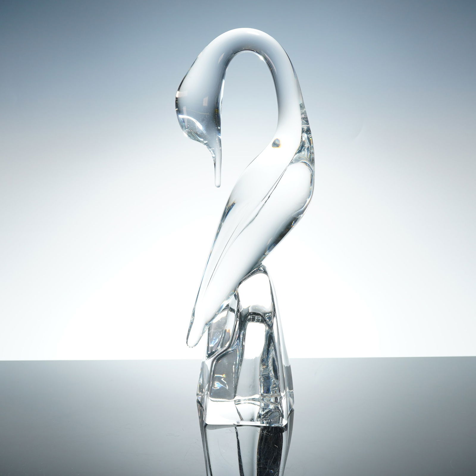 Daum France Hand-Sculpted Lead Crystal Heron Bird Sculpture: Produced by the renowned French glassmaker Daum, this sculpture is hand-sculpted from solid clear lead crystal. It features a minimalist, mid-century modern aesthetic with fluid, organic lines depicti