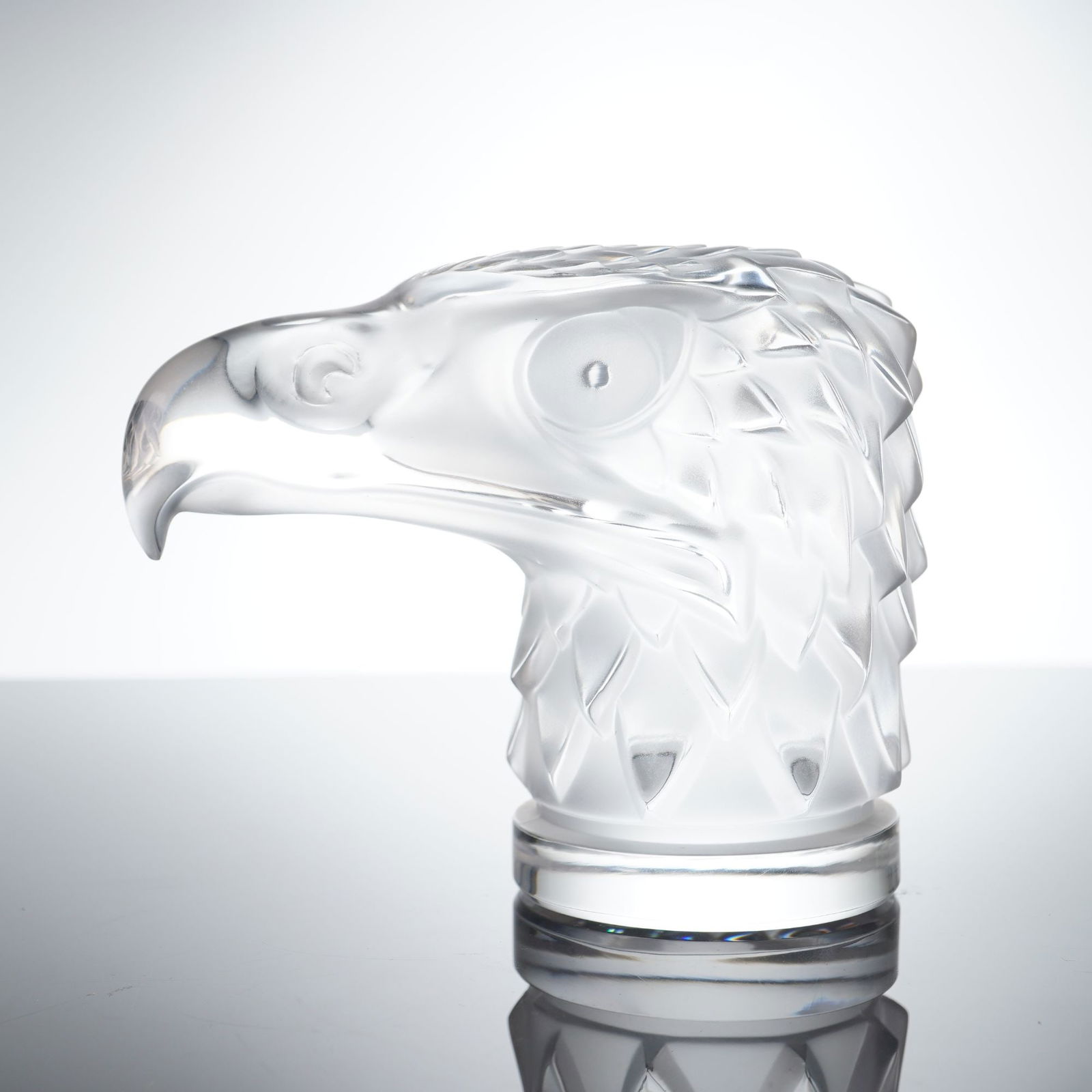 Lalique Frosted and Clear Crystal Tête d'Aigle Eagle Head Figurine: This Lalique crystal bird head figurine, known as the "Tête d'Aigle" (Eagle Head), is a quintessential example of French Art Deco-inspired glass design. Originally conceived by Rene Lalique in 1928 a