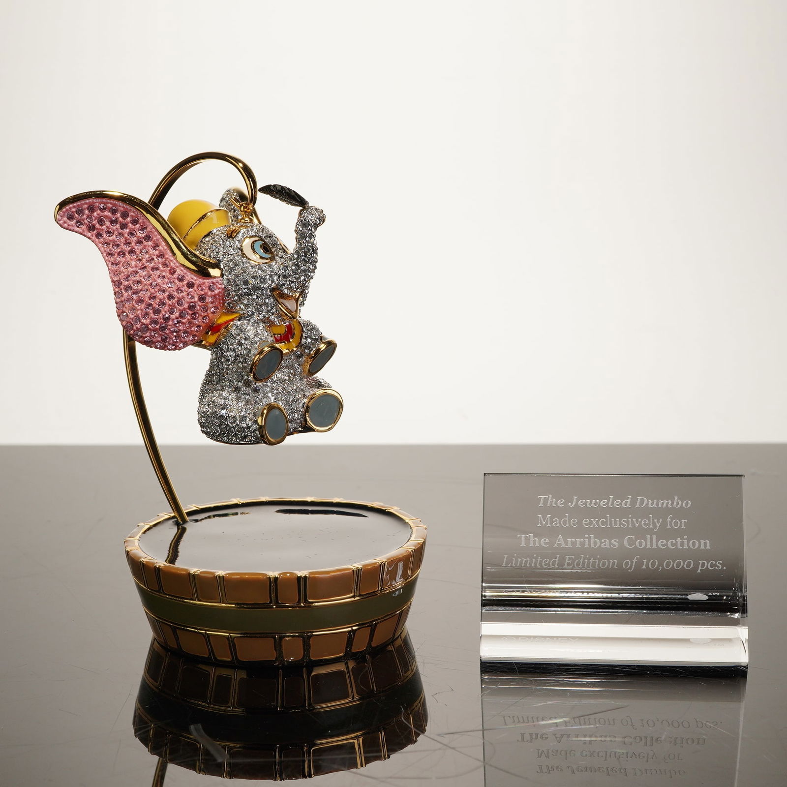 Arribas Brothers Jeweled Dumbo Swarovski Crystal Figurine Limited Edition.: Manufactured by Arribas Brothers for the Arribas Collection, this jeweled figurine depicts Disney's Dumbo the flying elephant. The piece is constructed from gold-tone metal and is densely encrusted wi