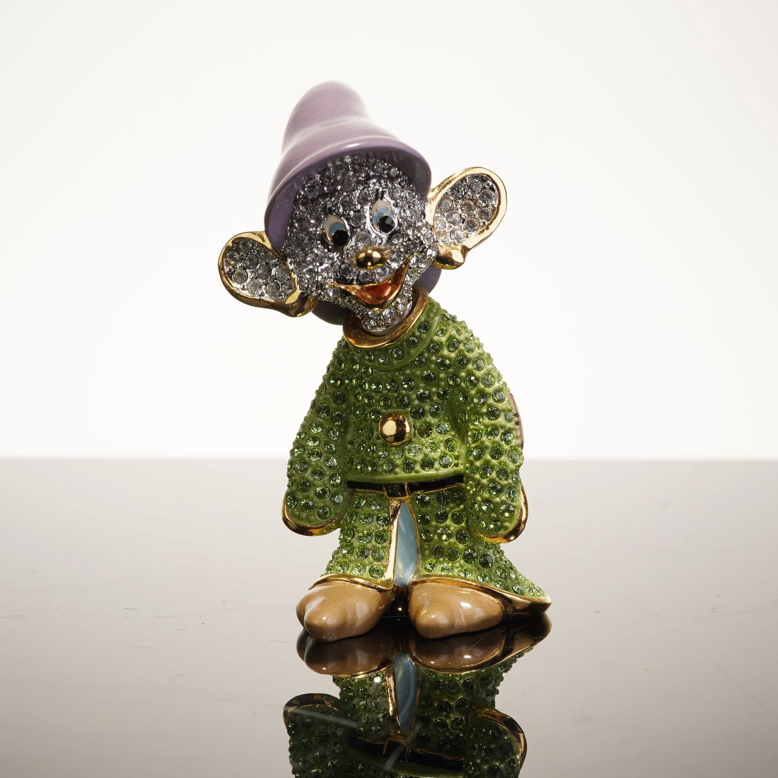 Arribas Brothers Swarovski Crystal Jeweled Dopey Miniature Figurine: Produced by Arribas Brothers for the Disney Parks, this jeweled miniature figurine is constructed from gold-tone metal with enamel accents and pave-set Swarovski crystals. The piece depicts the charac