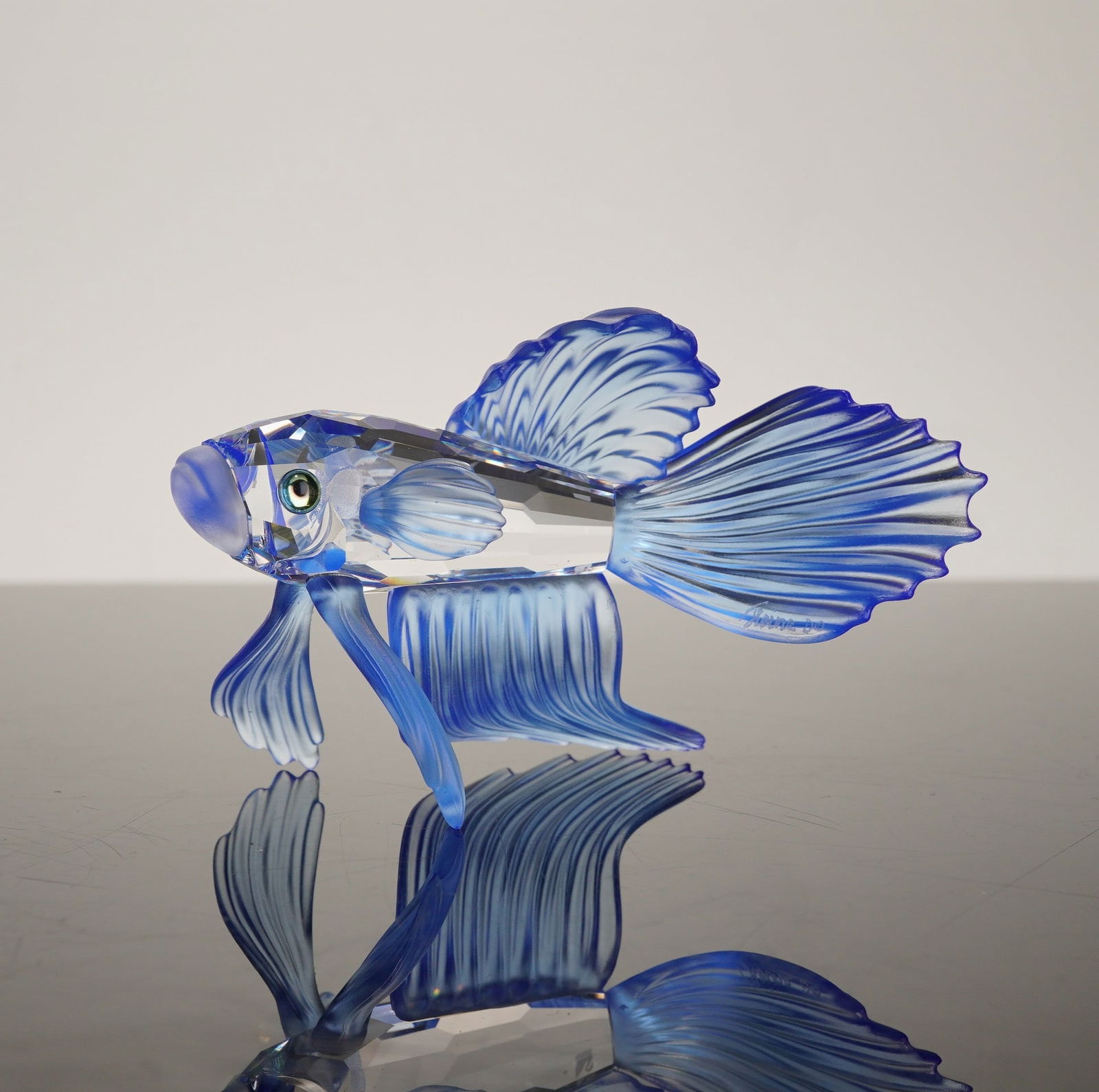 Swarovski Crystal Siamese Fighting Fish Blue Figurine: A retired Swarovski crystal figurine depicting a Siamese fighting fish, also known as a Betta splendens. This piece was originally part of the South Sea or Waterlife collection and is identified as mo