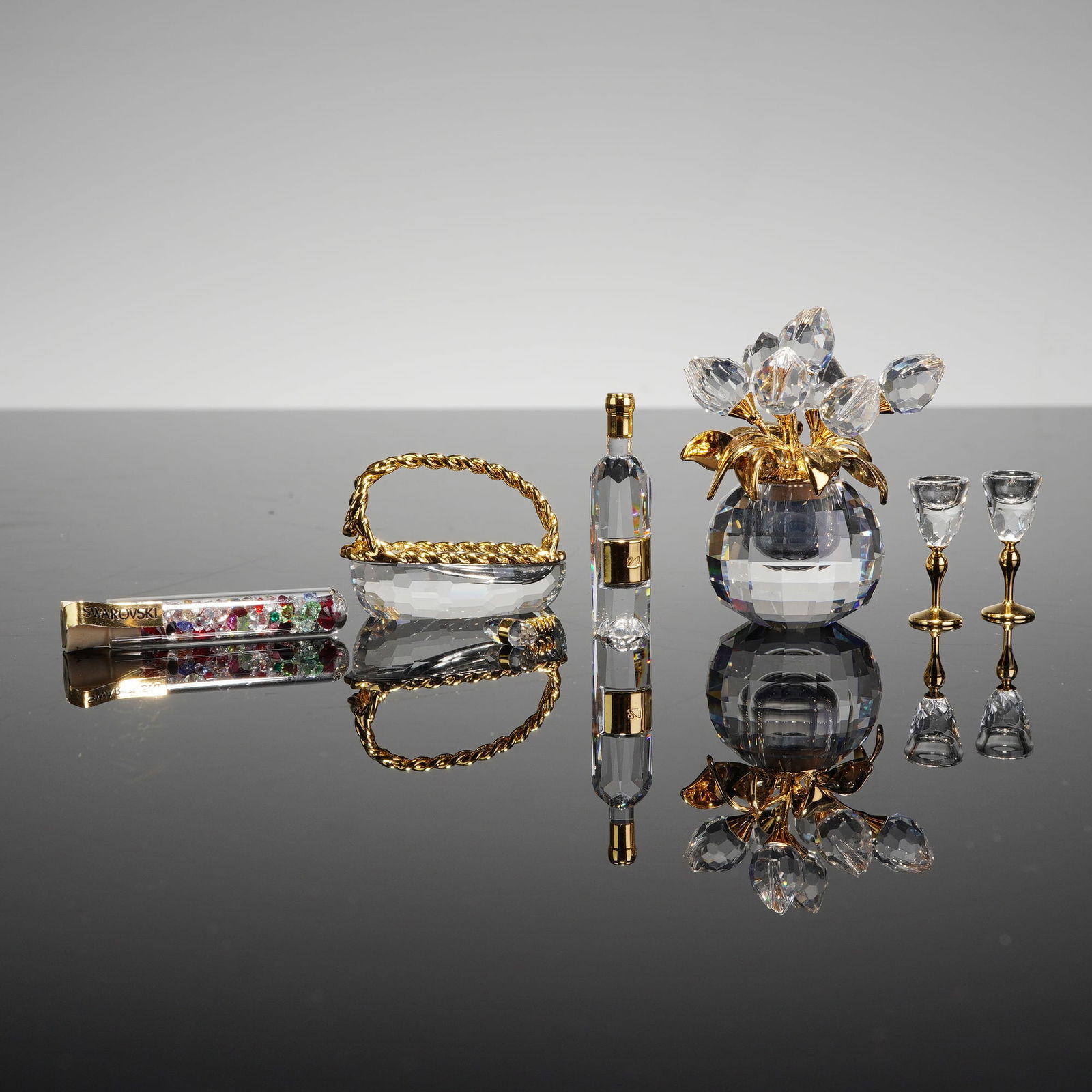 Swarovski Faceted Crystal and Gold-Tone Miniature Collection: Swarovski, precision-faceted lead crystal and gold-tone metal. This collection features fine Swarovski miniatures from the Crystal Memories and Secrets series, characterized by high-clarity crystal co