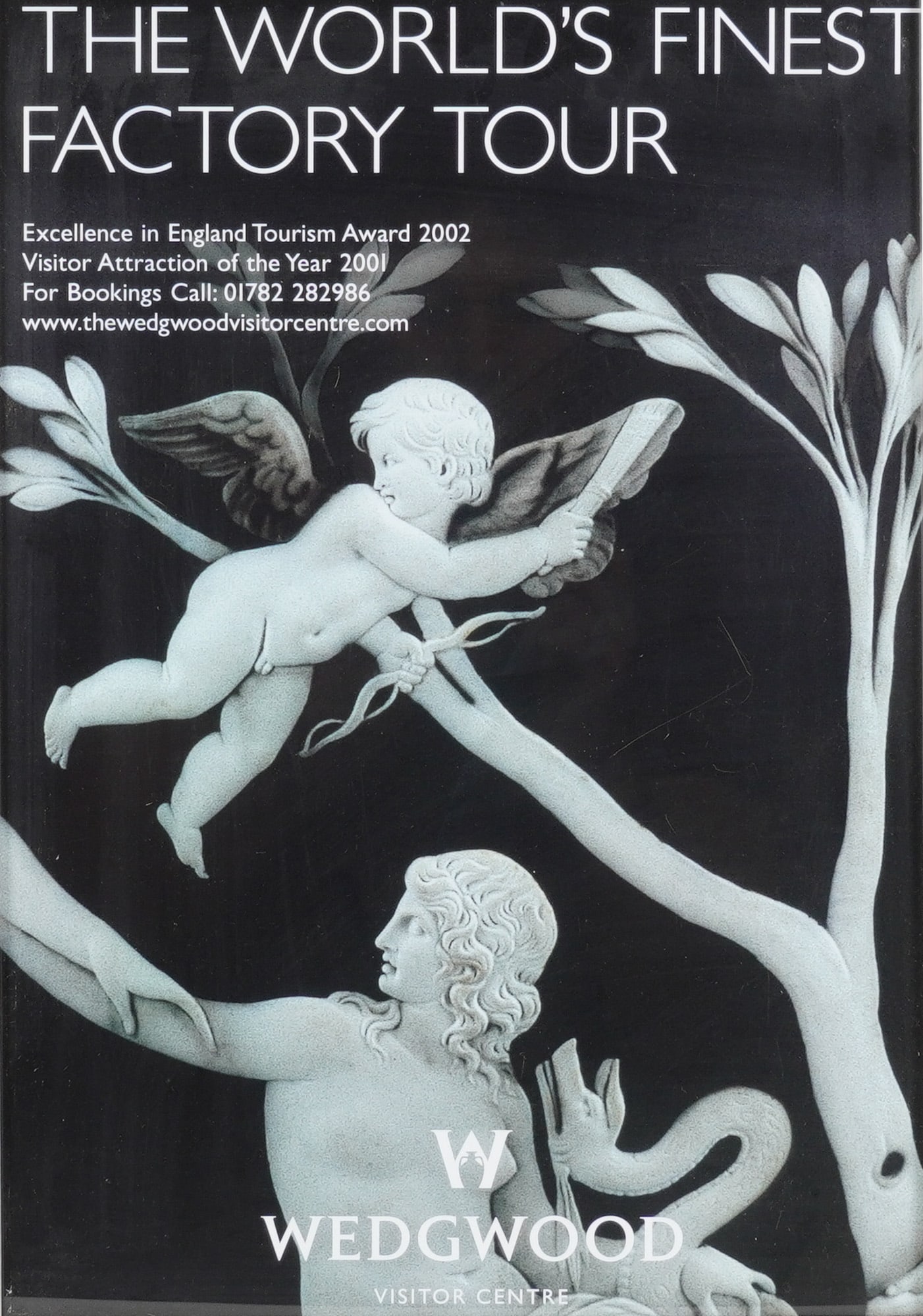 Framed Wedgwood Visitor Centre Factory Tour Poster: A framed Wedgwood poster advertising THE WORLD'S FINEST FACTORY TOUR and featuring a black and white classical illustration style resembling Jasperware relief. Housed in a modern silver tone frame. Di