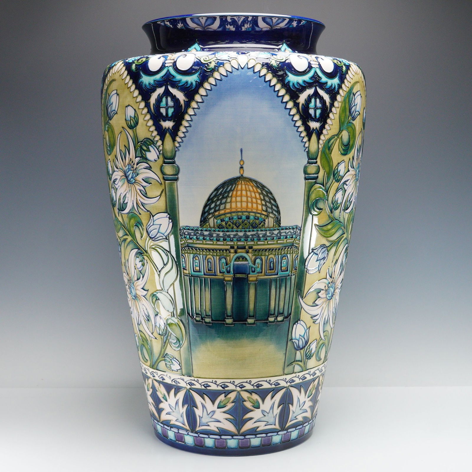 Moorcroft Pottery by Nicola Slaney Vase Jerusalem: Palatial vessel designed in a numbered edition, decorated with majestic flower pattern and illustrations featuring The Wailing Wall, The Dome of the Rock, and The Church of The Holy Sepulchre. Artist