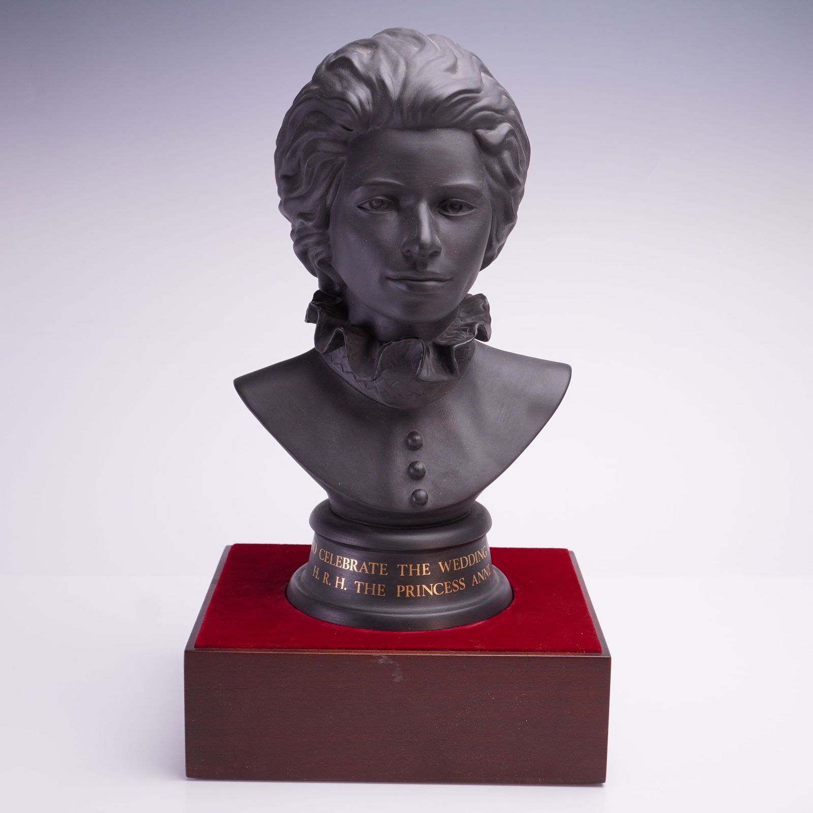 Royal Doulton Princess Anne Black Basalt Commemorative Bust No. 269: A Royal Doulton limited edition portrait bust of H.R.H. The Princess Anne, produced to celebrate the occasion of her wedding on November 14, 1973. The bust is crafted from black basalt stoneware with
