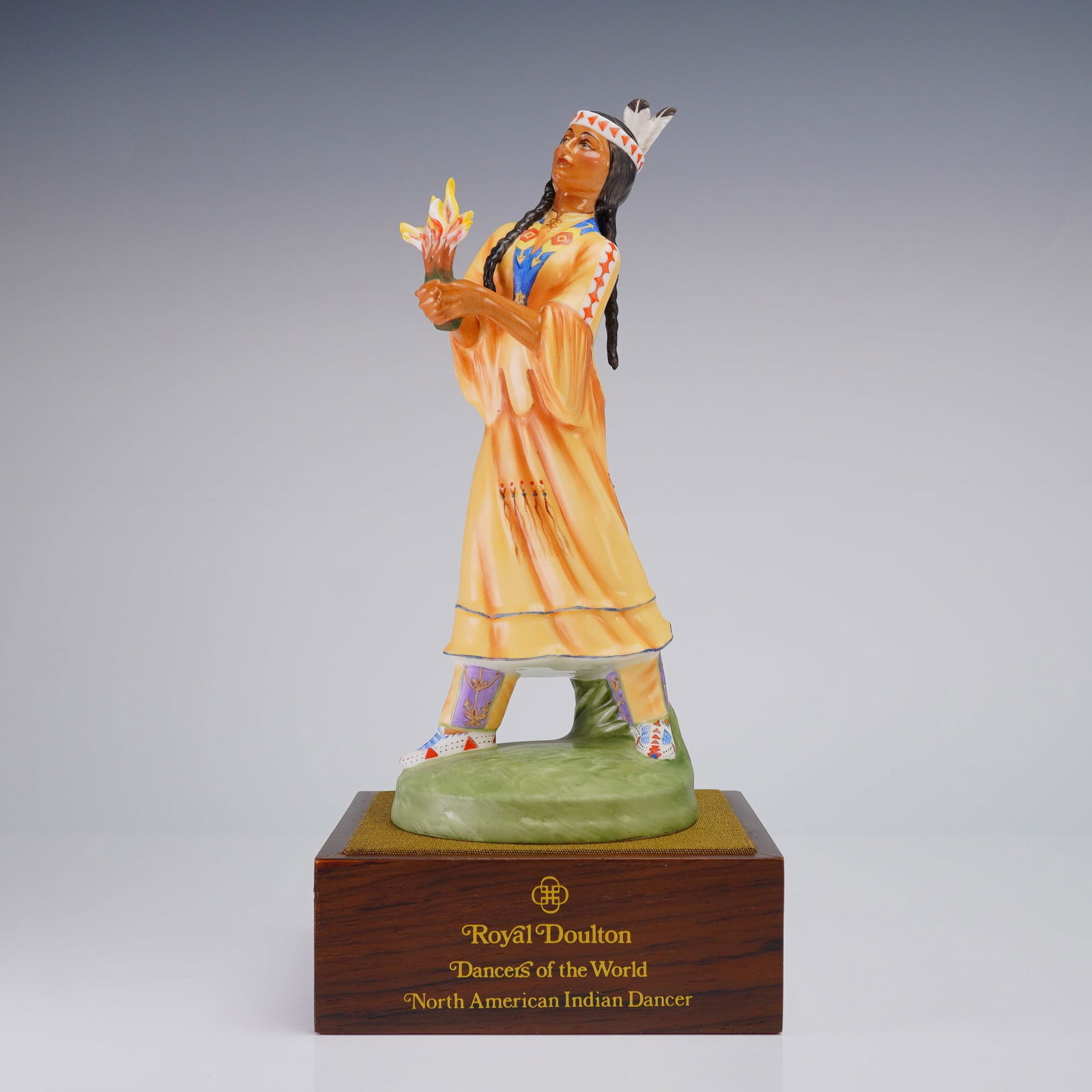 Royal Doulton North American Indian Dancer HN 2809 Figurine: A limited edition Royal Doulton porcelain figurine, "North American Indian Dancer" HN 2809, modeled by Peggy Davies in 1982, numbered 567 of 750, presented on a wooden base and accompanied by its red