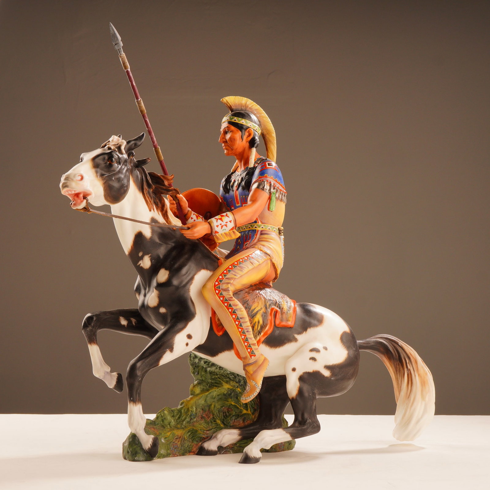 Royal Doulton Indian Brave Limited Edition Figurine HN2376: This Royal Doulton bone china figurine, titled Indian Brave (model HN 2376), was designed by Margaret (Peggy) Davies. The sculpture depicts a Native American warrior in detailed traditional attire mou