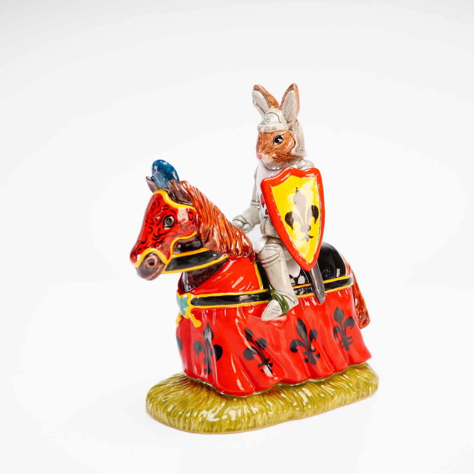 Royal Doulton Prototype Sir Lancelot Bunnykins Figurine: An exceptional prototype of Sir Lancelot Bunnykins DB301, featuring the rabbit knight in a white tabard adorned with red fleur-de-lis over his grey armour. Mounted on a chestnut steed, the horse's reg