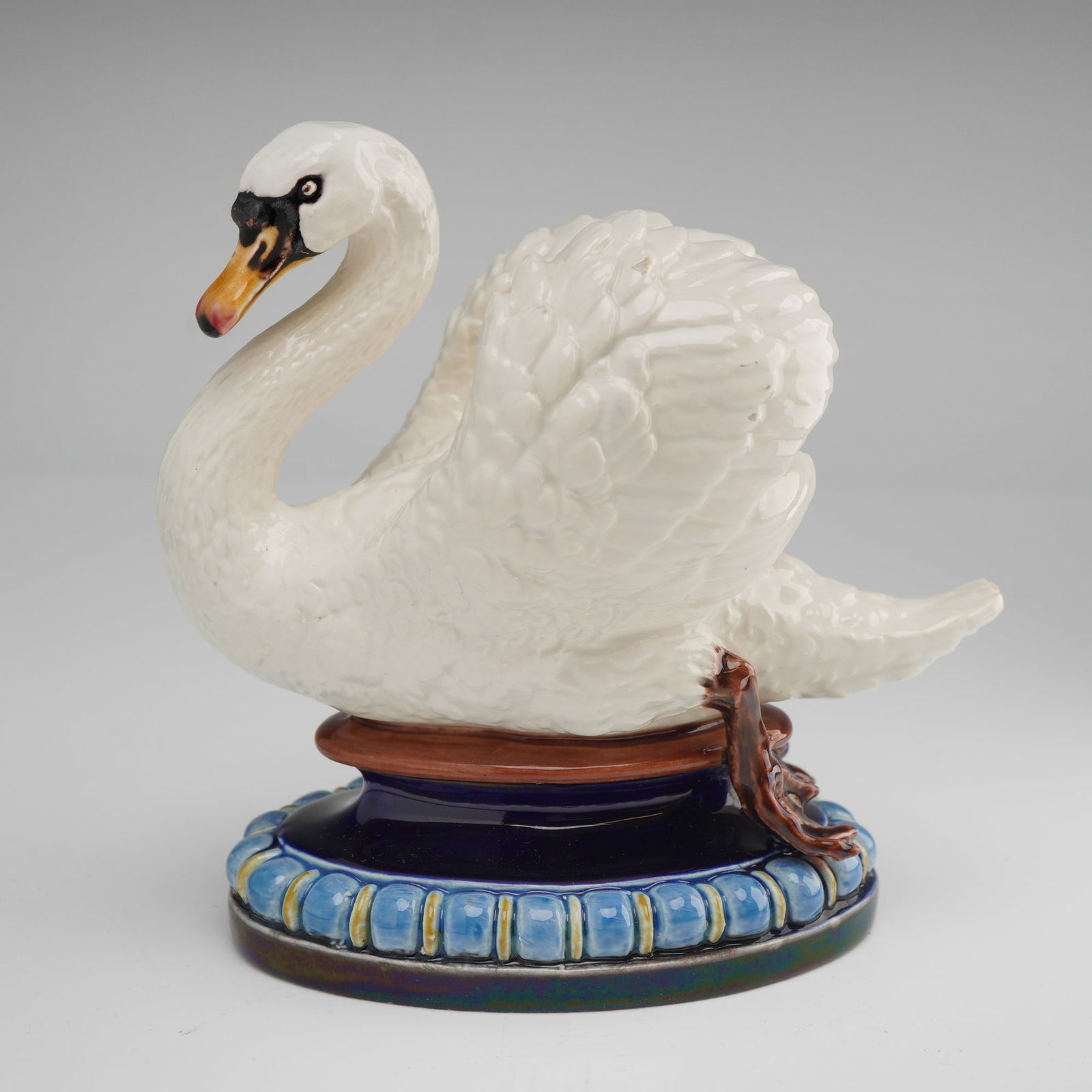 Hugo Lonitz German Majolica Swan Figure: A fine German Majolica glazed earthenware figure of a swan, attributed to the factory of Hugo Lonitz and Company, Neuhaldensleben, circa 1880-1890. The bird is naturalistically modeled in a seated pos