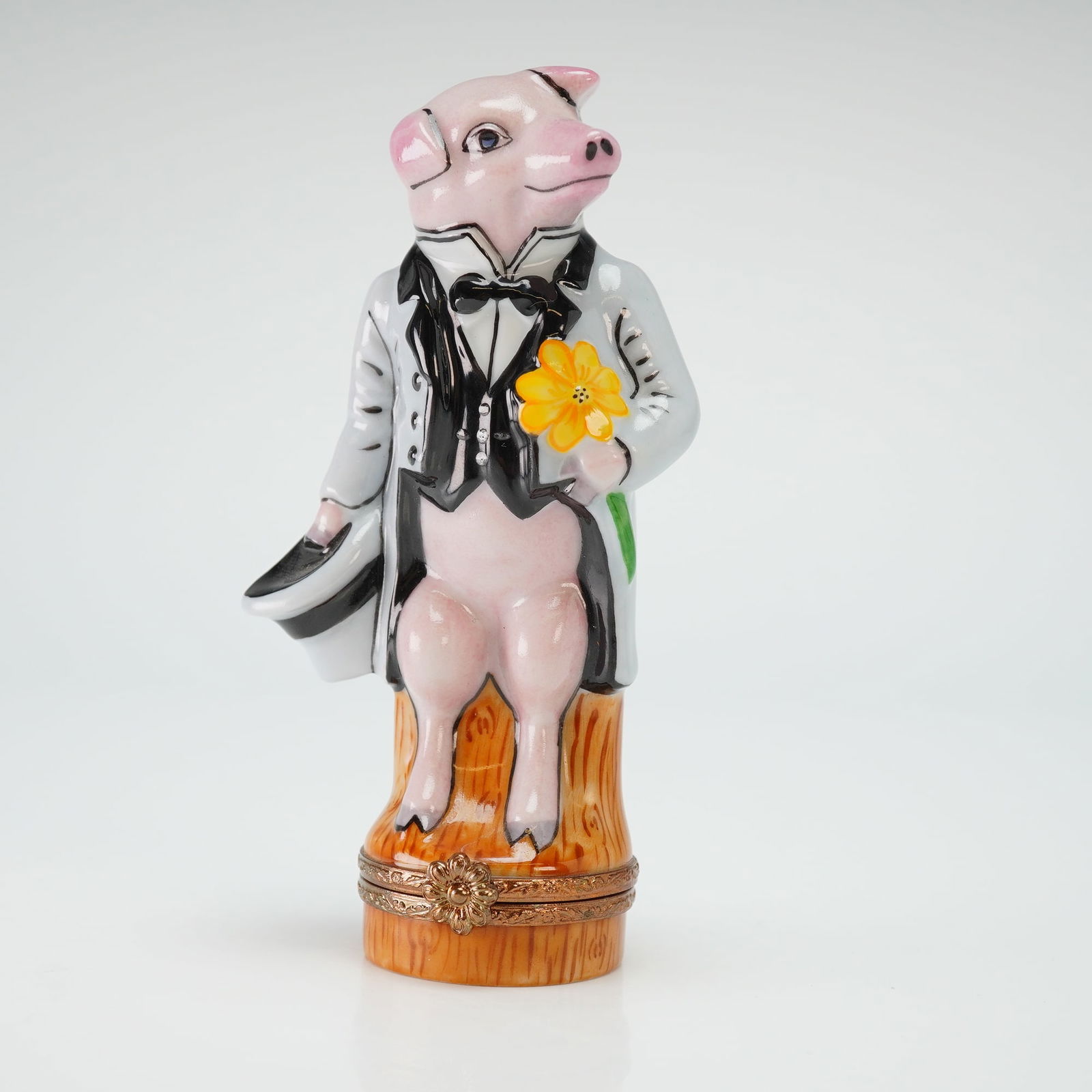 Limoges Porcelain Gentleman Pig Treasure Box: A fine hand-painted porcelain treasure box from Limoges, France, featuring an anthropomorphic Gentleman Pig figure. This retired design depicts the pig whimsically rendered in formal attire, including