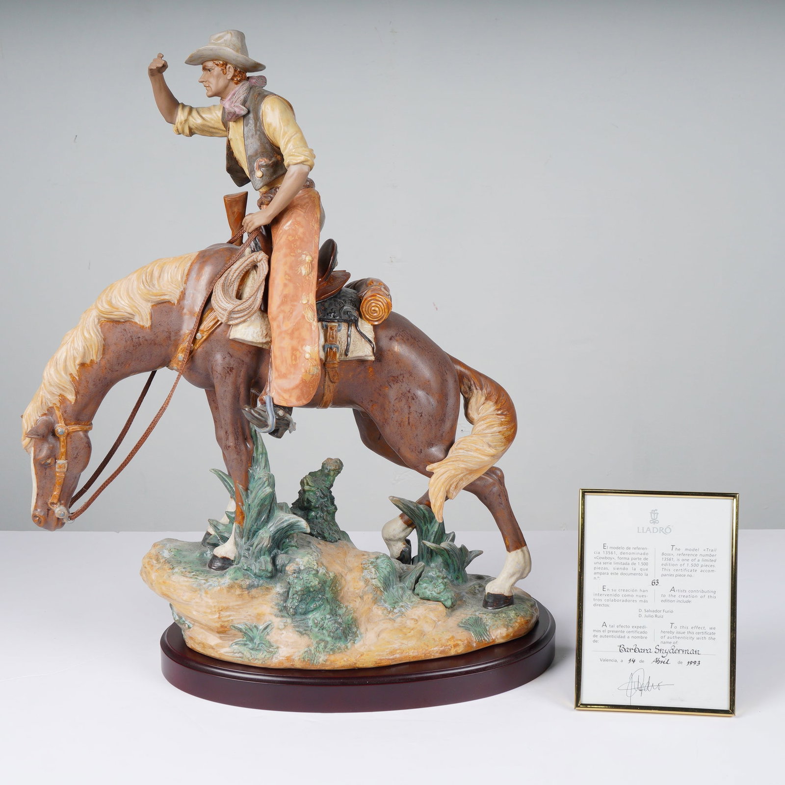 Lladro Trail Boss Limited Edition Porcelain Figurine with Certificate: This multi-colored Lladro porcelain figurine titled Trail Boss, reference 10113561 from the American West Collection, is number 63 of 1,500 and includes a base and framed certificate of authenticity.