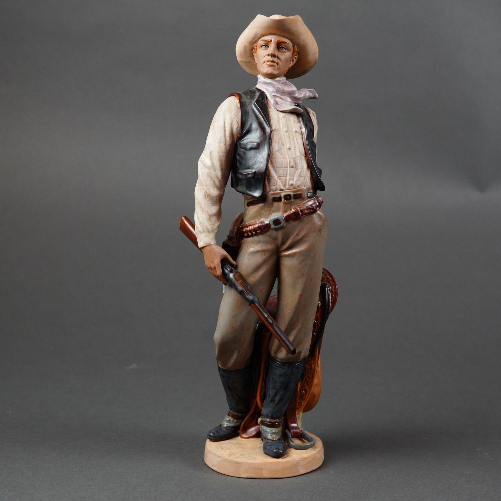 Lladro American Cowboy Limited Edition Figurine: A large-scale porcelain sculpture from the Lladro American West Collection titled American Cowboy, model number 13568. The figure is expertly crafted with a combination of matte bisque and high-gloss