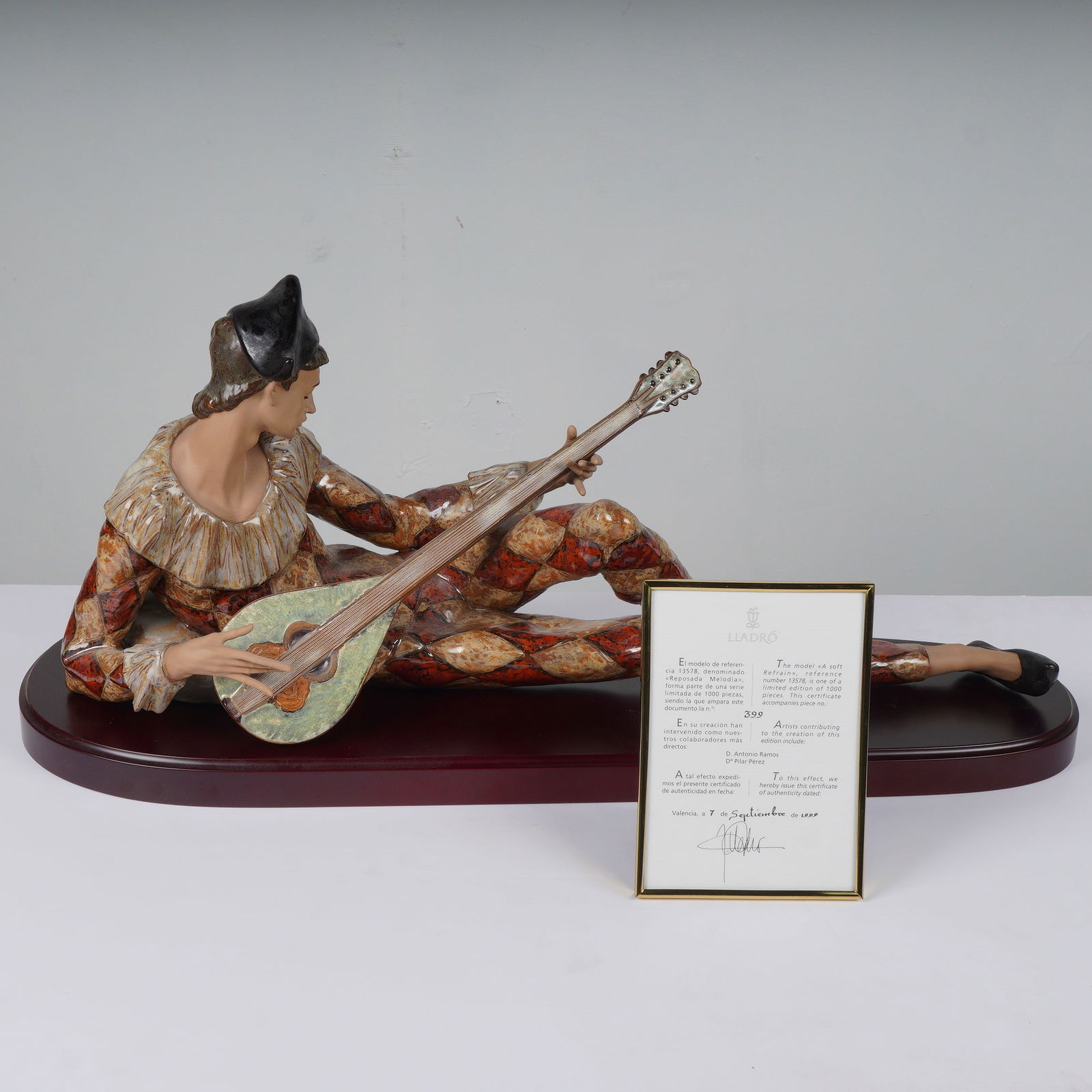 Lladro A Soft Refrain: A large and masterfully executed Lladro porcelain figurine titled A Soft Refrain (Spanish: Reposada Melodia), model number 1013578. This limited edition piece, numbered 399 of 1000, depicts a