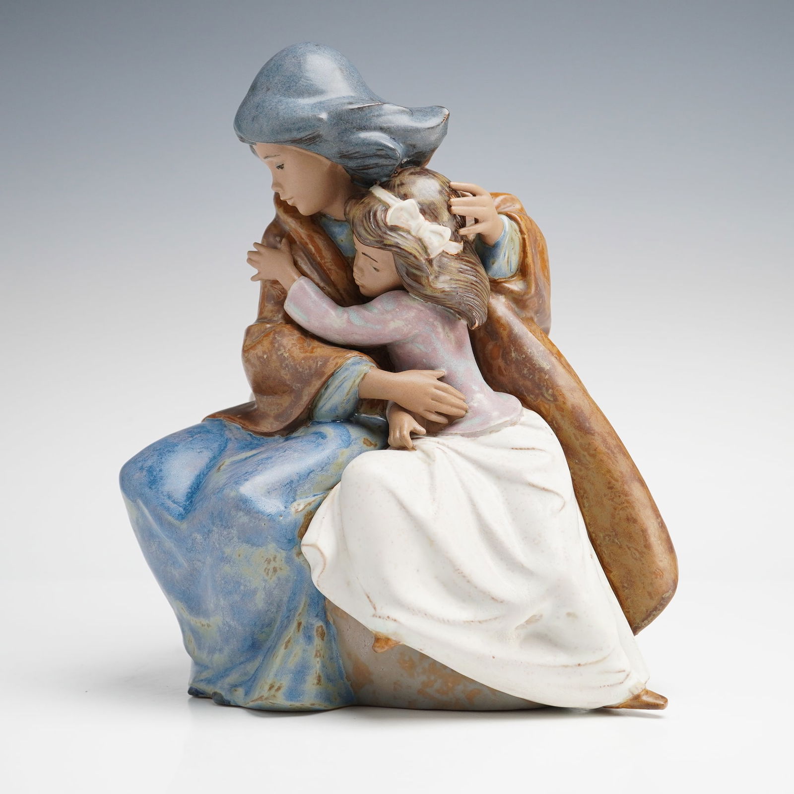 Lladro Sisterly Love Figurine (Model 2206): A Lladro Gres stoneware figurine titled Sisterly Love, cataloged as Item 01012206 and designed by sculptor Jose Puche. Issued in 1990 and retired in 2004, this piece depicts two figures in a tender em