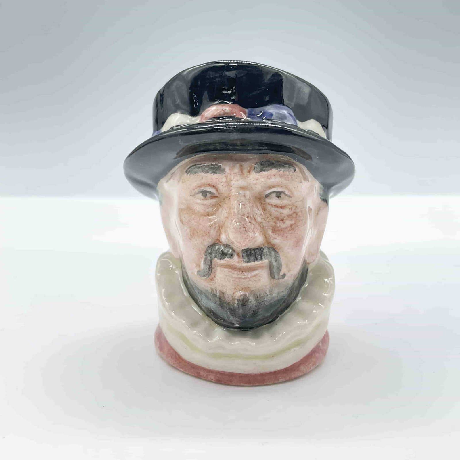 Beefeater ER Pink D6251 - Mini - Royal Doulton Character Jug: Royal Doulton backstamp. ArtistHarry Fenton Dimensions2.5"H Date or Era1953 - 1953 Manufacturer or BrandRoyal Doulton Country of OriginEngland