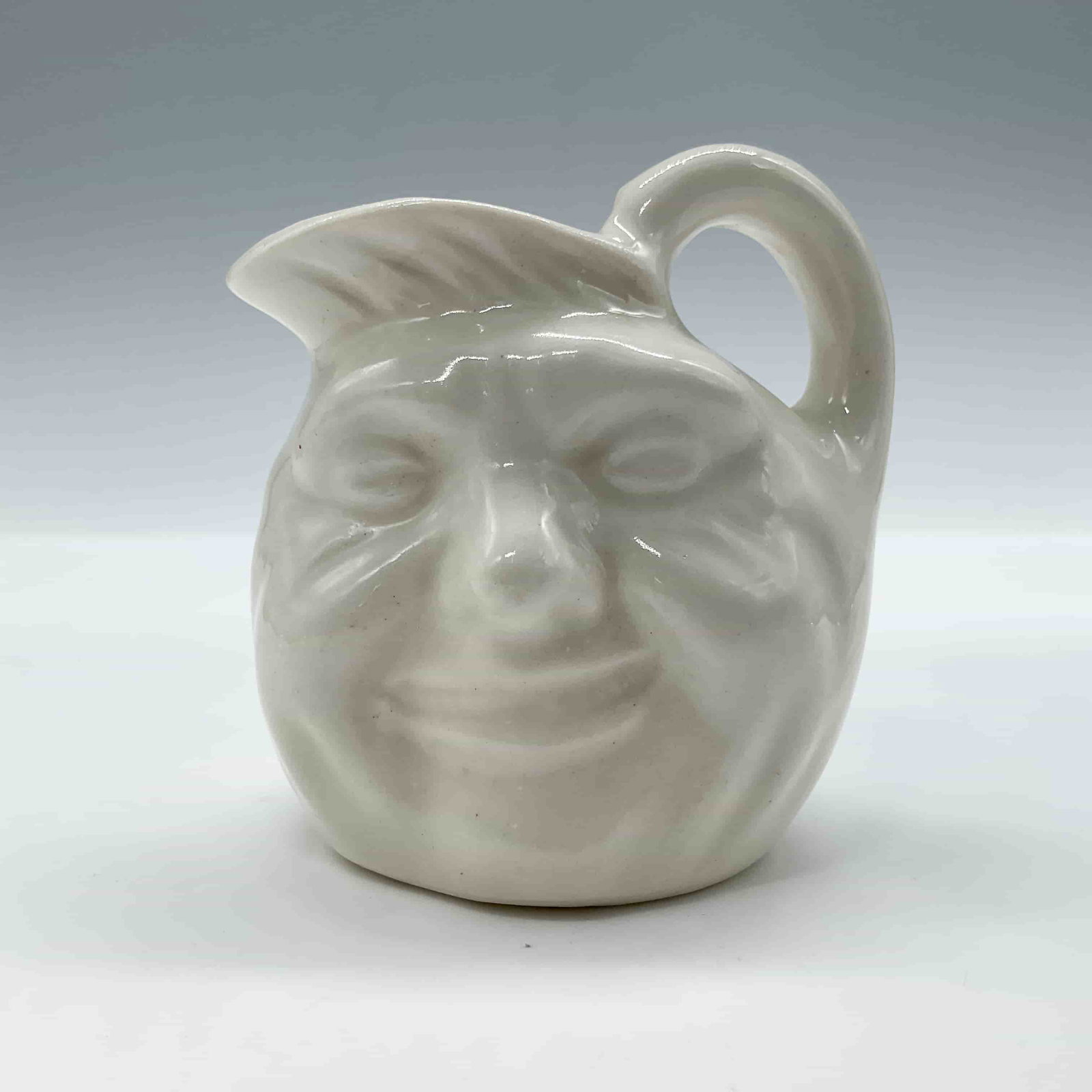 John Barleycorn D6041 - Mini - Royal Doulton Character Jug: Undecorated, handle inside. Plain back. ArtistCharles J. Noke Dimensions2.5"H Date or Era20th c. Manufacturer or BrandRoyal Doulton Country of OriginEngland