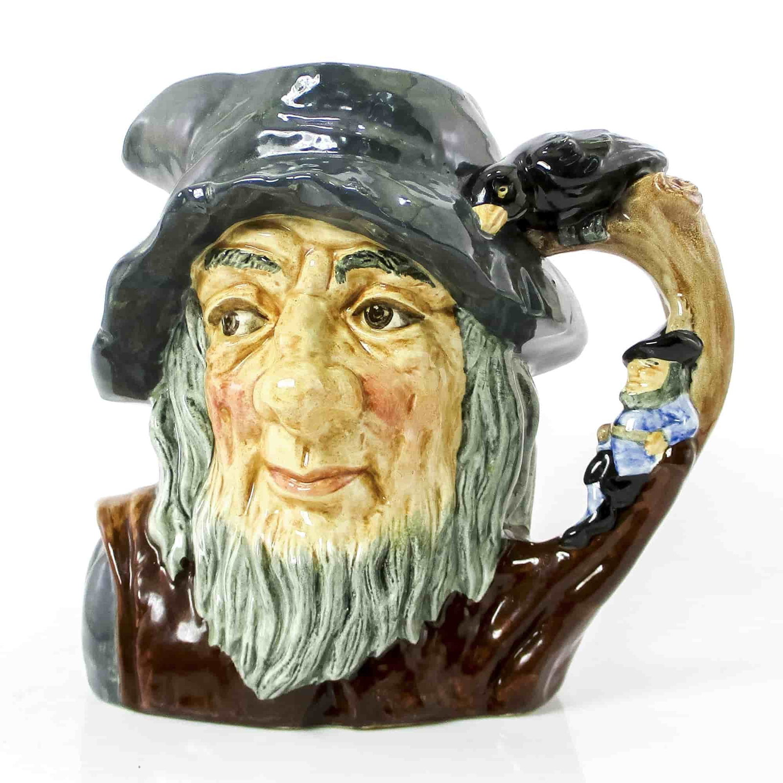Rip Van Winkle D6438 - Large - Royal Doulton Character Jug: Variation One. Grey-blue cap; brown robes; figure dressed in blue resting against tree. In 1820, the American writer Washington Irving wrote the story of Rip Van Winkle, based on legends he had heard