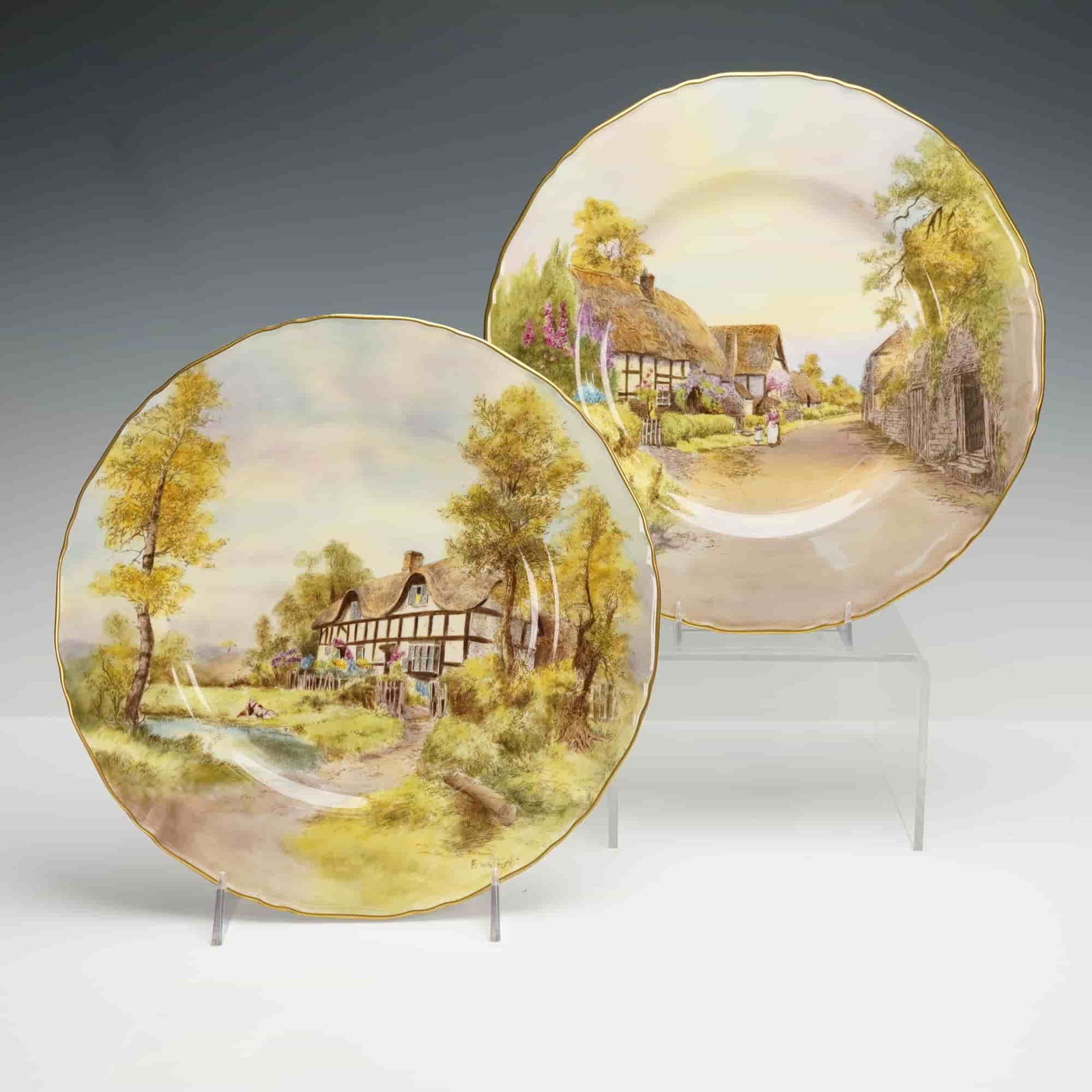 2pc Royal Worcester Porcelain Cabinet Plates, Little Combeton and Elmley: Two hand painted plates with picturesque English rural landscapes, one titled Elmlery and signed by the artist F. Whitford and the other titled Little Combeton and signed by the artist to the left