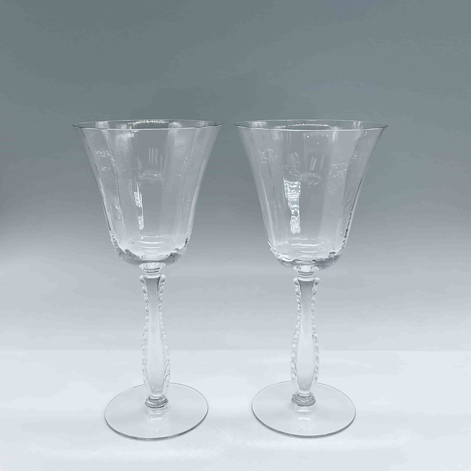 2pc Fostoria Water Goblets, Silver Flutes: Pair of clear stemmed glasses with a pillowed wave pattern on the inner bowl. Dimensions7.75"H x 3.75" dia Manufacturer or BrandFostoria Country of OriginUnited States