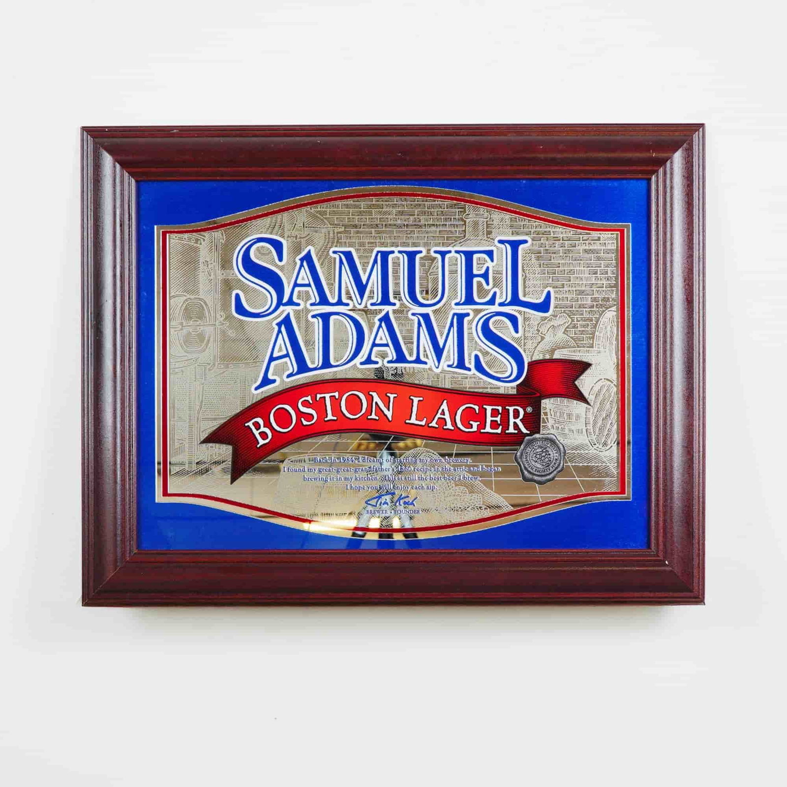 Samuel Adams Boston Lager Mirror Sign in Wooden Frame: Offered here is a striking Samuel Adams Boston Lager advertising mirror, beautifully framed in rich wood. This classic piece features the bold Samuel Adams branding in vivid blue and red against a det