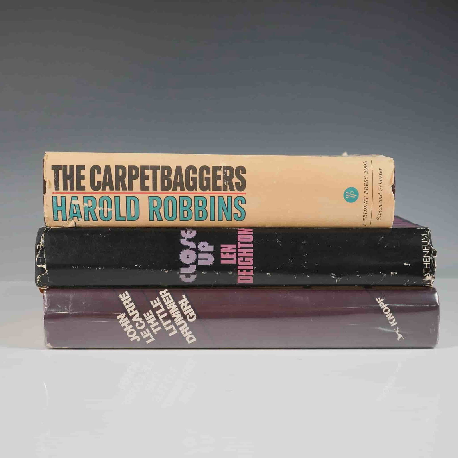 3 Thriller and Drama Books: Titles including: The Little Drummer Girl by John le Carre (1983); Close-Up by Len Deighton (1972); The Carpetbaggers by Harold Robbins (1961). These novels span espionage, thriller, and historical