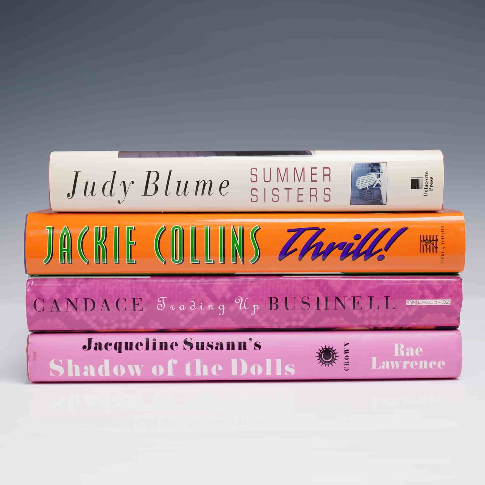 4pc Hardcover Book Lot Blume Collins Bushnell Lawrence: Four-piece hardcover book lot featuring bestselling fiction by popular female authors. Titles include Summer Sisters by Judy Blume, Thrill! by Jackie Collins, Trading Up by Candace Bushnell, and