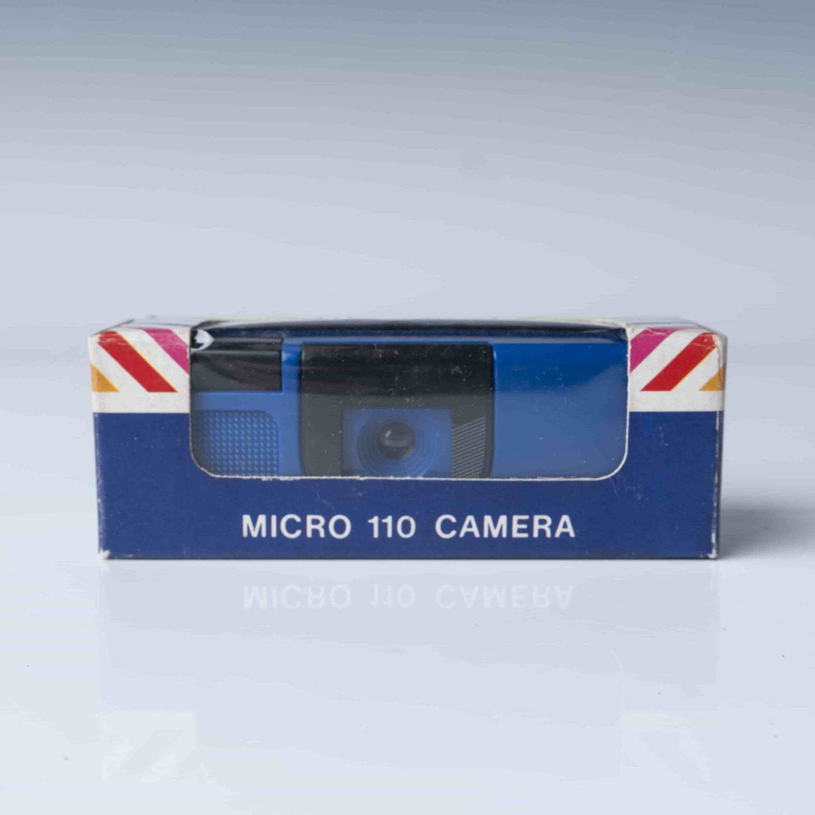 Hi-Tech Micro 110 Camera in Original Box: A vintage Hi-Tech Micro 110 Camera, model No. 120-1, housed in its original packaging. This compact camera features a flip-up viewfinder, drop-in 110 film capability, and a straightforward