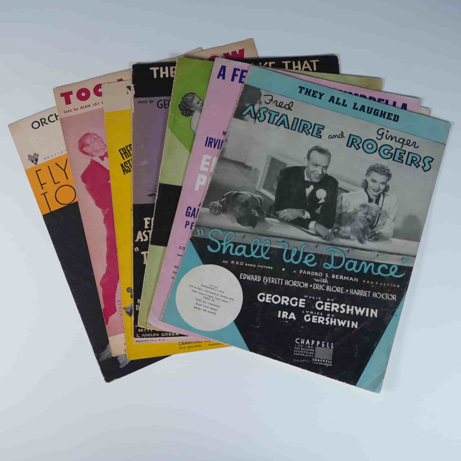 9pc Vintage Sheet Music Collection, Gershwin & More: A collection of 9 vintage sheet music booklets featuring classic compositions from legendary songwriters, including George and Ira Gershwin. Notable pieces include They All Laughed and Shall We Dance,