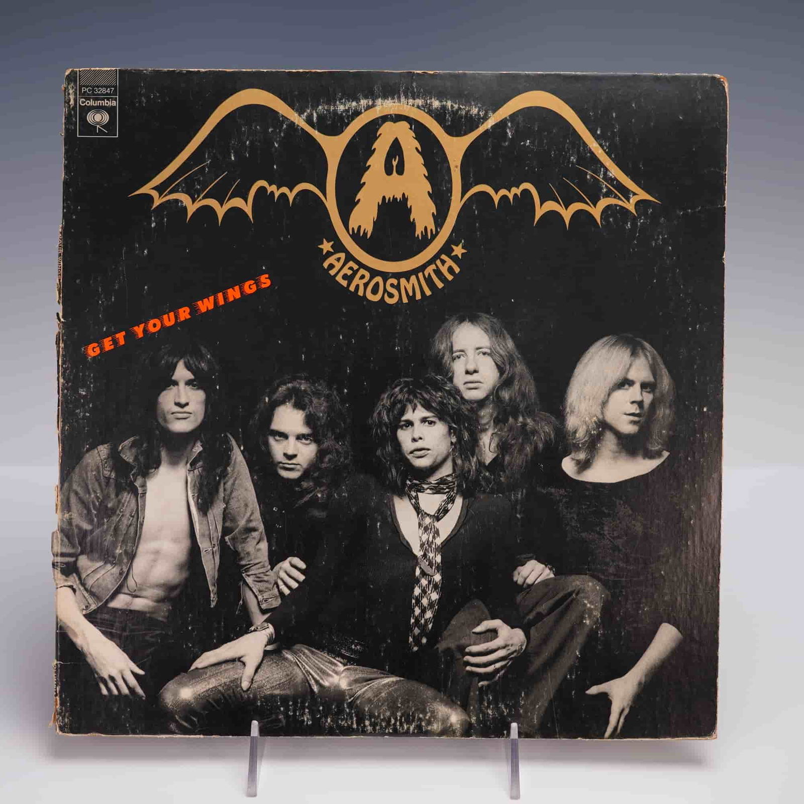 Aerosmith Get Your Wings LP Columbia Vinyl Record: Original 1974 pressing of Aerosmith's Get Your Wings LP on Columbia Records, catalog number PC 32847. This early red label pressing features matrix number P AL 32847-1C etched in the runout, identifyi