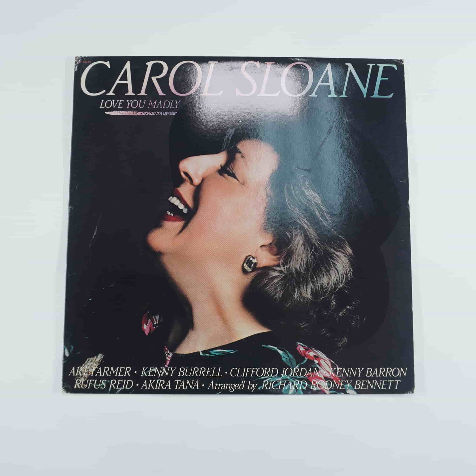 Carol Sloane Vinyl Record, Love You Madly: Released by Contemporary Records, is a jazz album showcasing the vocalist's interpretations of classic jazz and vocal standards. The album features notable musicians including Art Farmer, Kenny Burrel