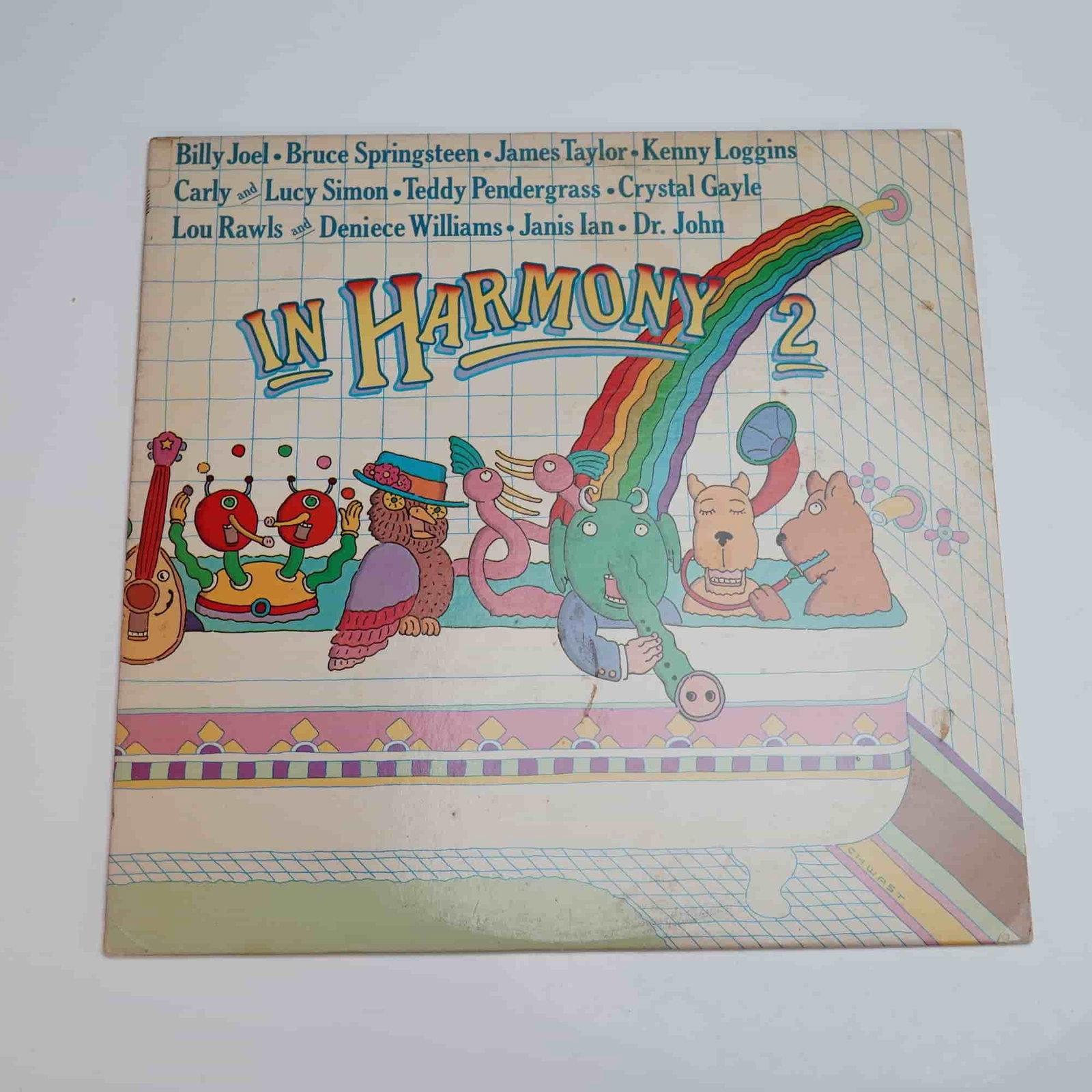 Columbia Records In Harmony 2 LP Compilation Vinyl Reocrd: An original 1981 pressing of In Harmony 2, a collaborative vinyl LP produced by Lucy Simon and David Levine for Columbia Records. This vibrant children's music compilation features an impressive lineu