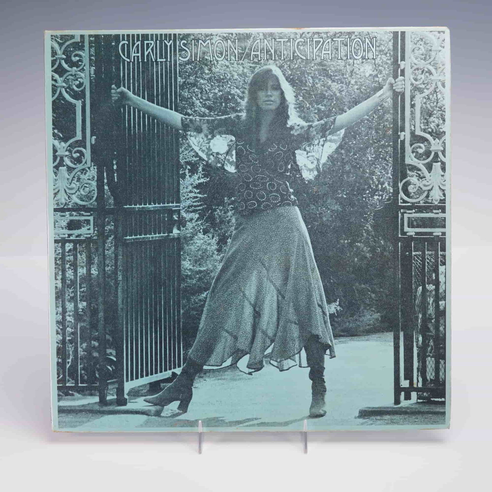 Elektra Records Carly Simon Vinyl Record, Anticipation: A 1971 U.S. pressing of Carly Simon's "Anticipation" LP vinyl album, issued by Elektra Records. The front cover presents a stylized monochromatic photograph of the artist gracefully poised between wro