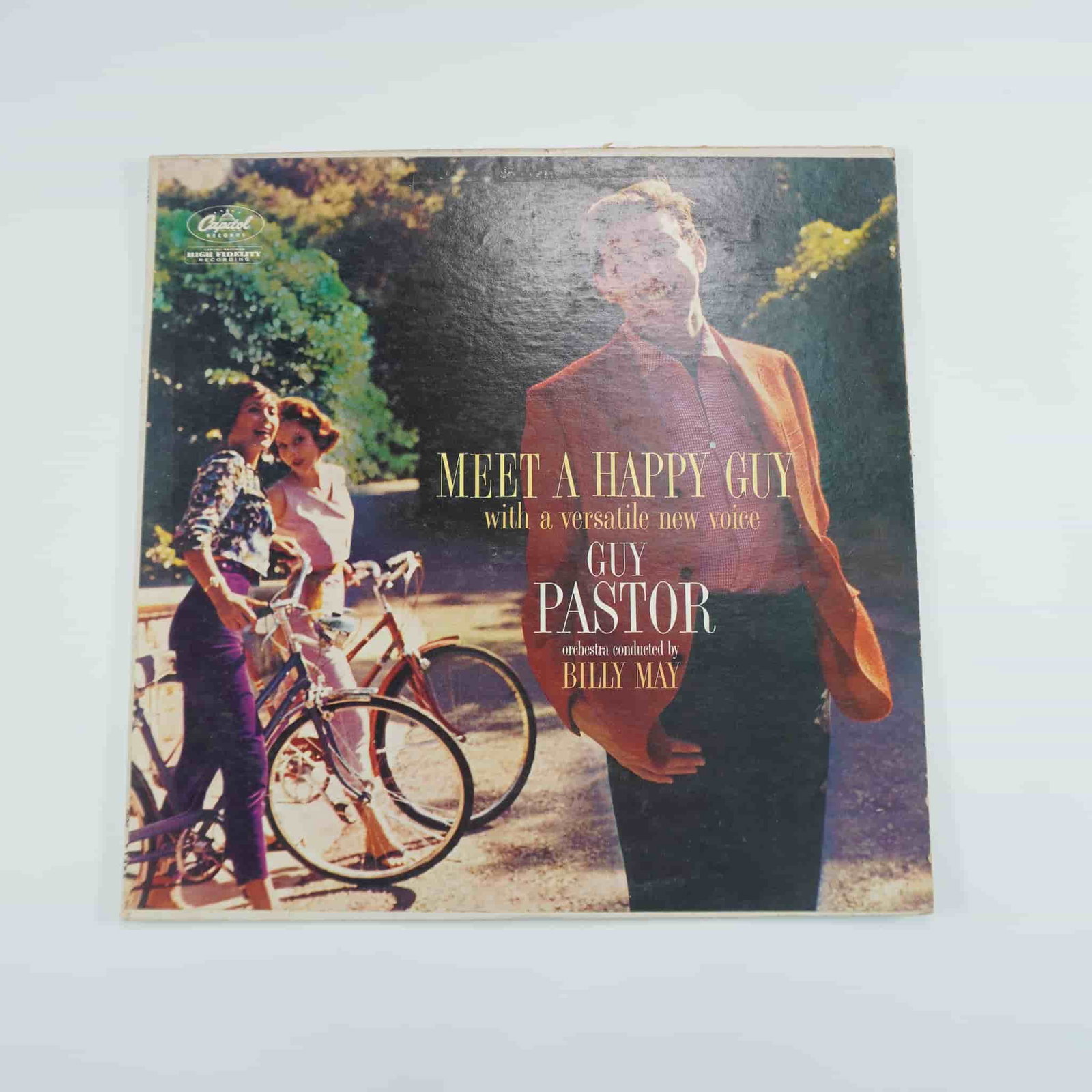 Guy Pastor Meet a Happy Guy with Billy May Vinyl LP: Original pressing of Meet a Happy Guy by Guy Pastor, conducted by Billy May, released on Capitol Records. This album showcases Pastor's smooth vocals backed by Billy May’s iconic orchestral arrangem
