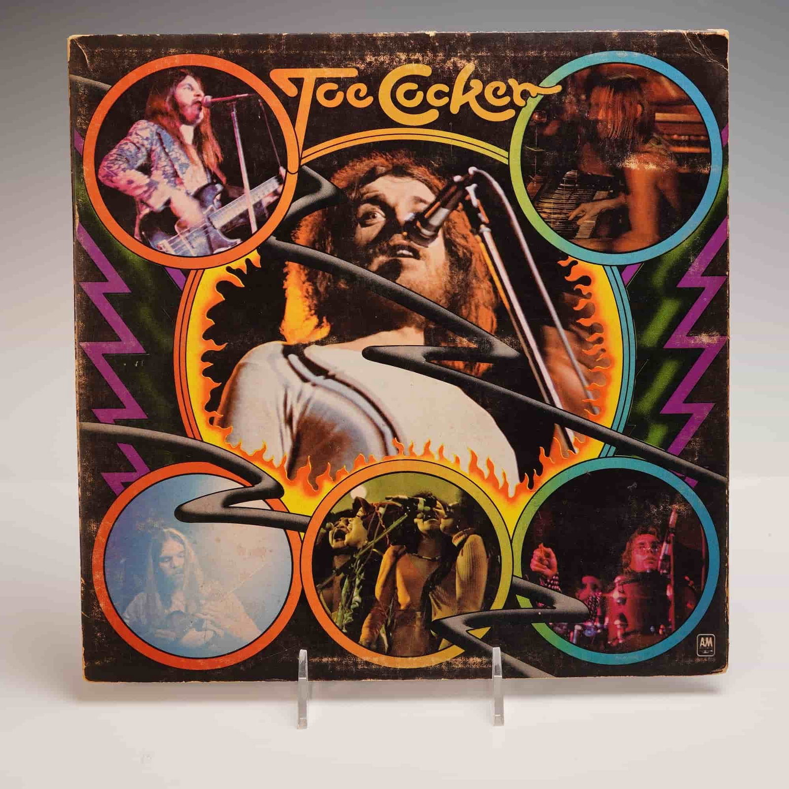 Joe Cocker Live LP Record, A&M Records SP-4635: A vintage vinyl record featuring legendary English rock and blues singer Joe Cocker, issued by A&M Records under catalog number SP-4635. The colorful psychedelic gatefold sleeve showcases Cocker in co