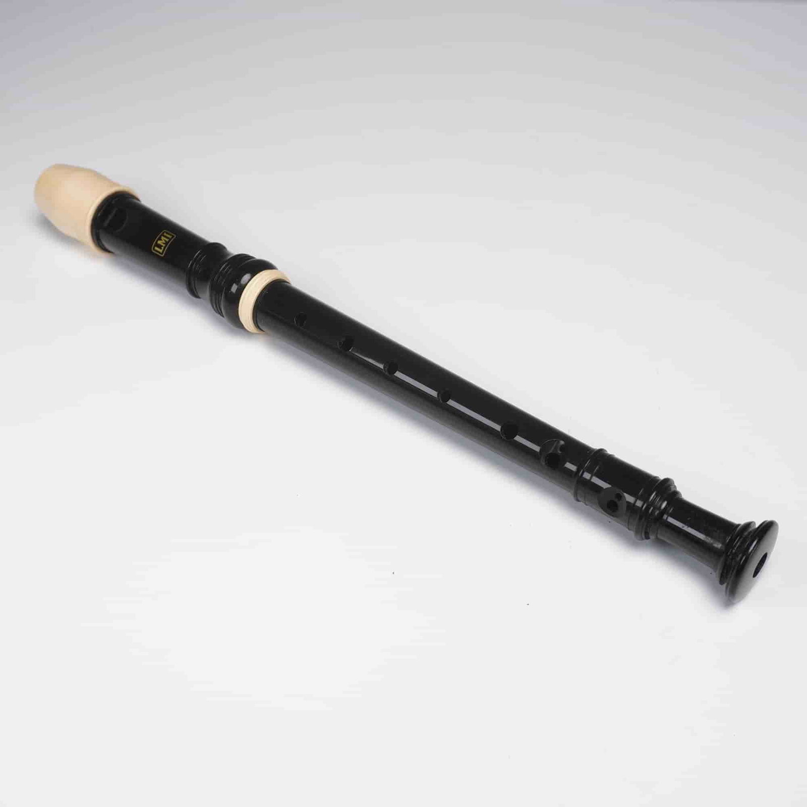 LMI Black Plastic Soprano Recorder with Case: A black plastic soprano recorder marked LMI and designed in three-part construction with cream-colored mouthpiece and joint rings. The instrument features eight finger holes and comes housed in a brow