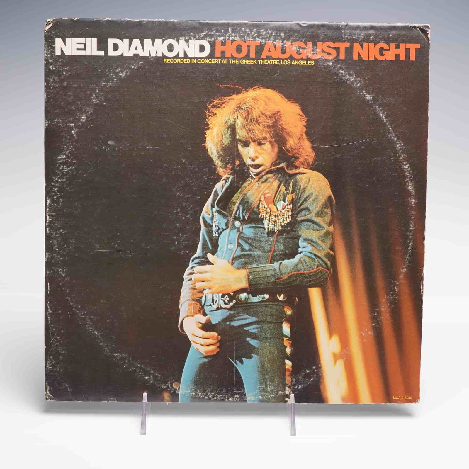 MCA Records Neil Diamond Vinyl Record, Hot August Night: A double LP live album titled Hot August Night by Neil Diamond, released in 1972 by MCA Records. This iconic concert recording was captured live at the Greek Theatre in Los Angeles and is presented in