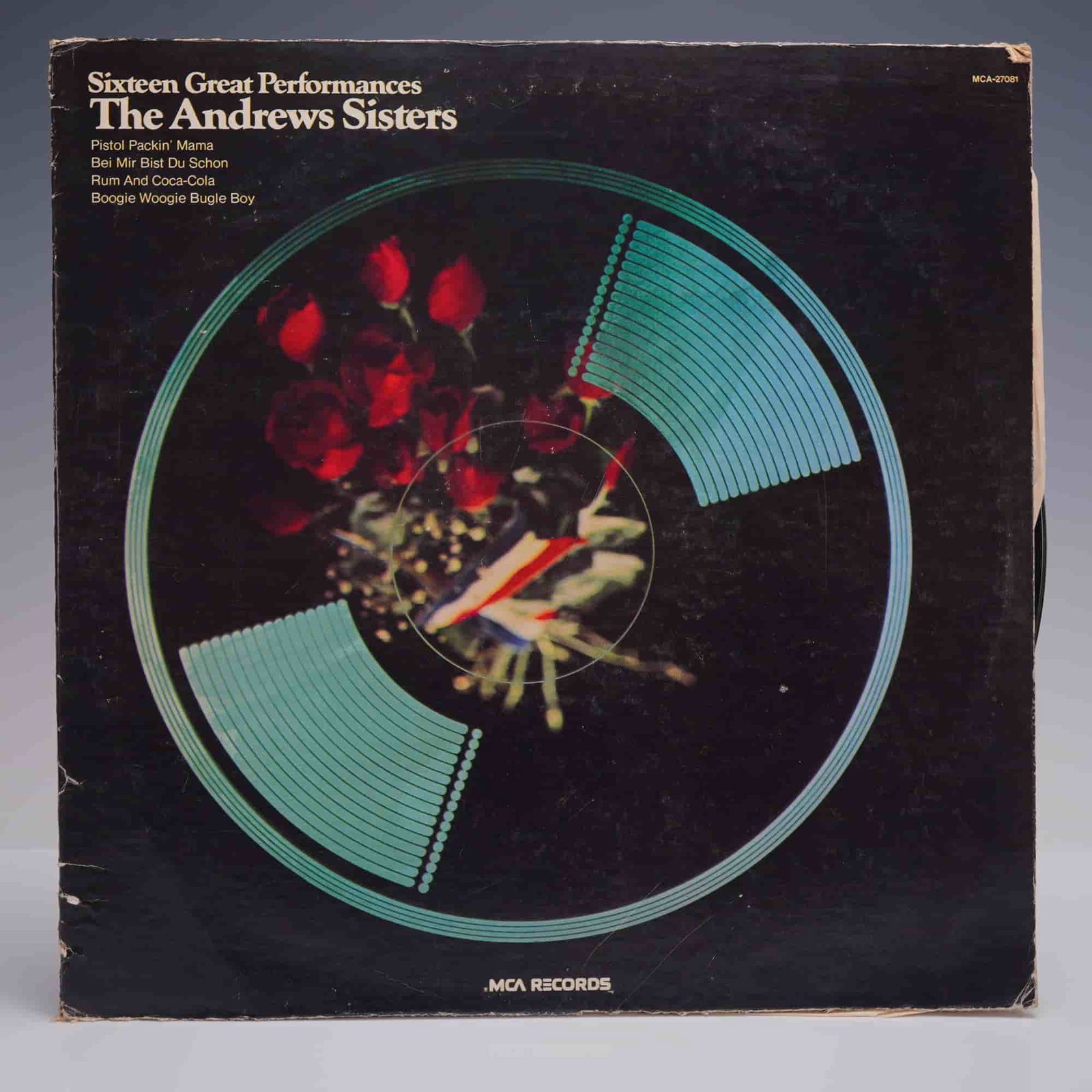 The Andrews Sisters - Sixteen Great Performances LP Record, 1974: The Andrews Sisters Sixteen Great Performances, 1974 MCA Records compilation (MCA-27081), featuring beloved wartime and swing-era classics including: Boogie Woogie Bugle Boy, Rum and Coca-Cola, Bei Mi